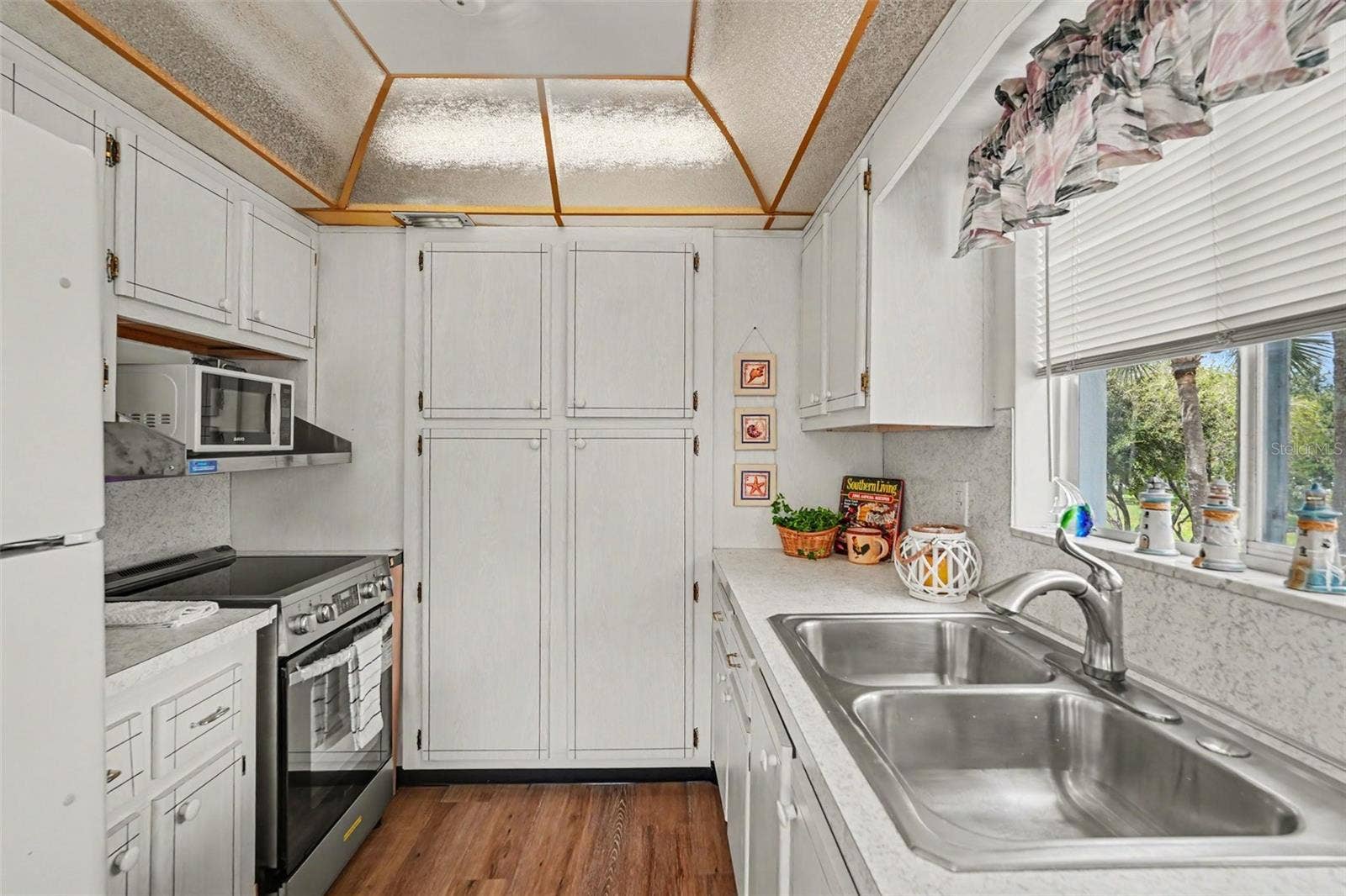 11201 80TH AVENUE, #209, Seminole, FL 33772 Galley style kitchen has lots of storage!