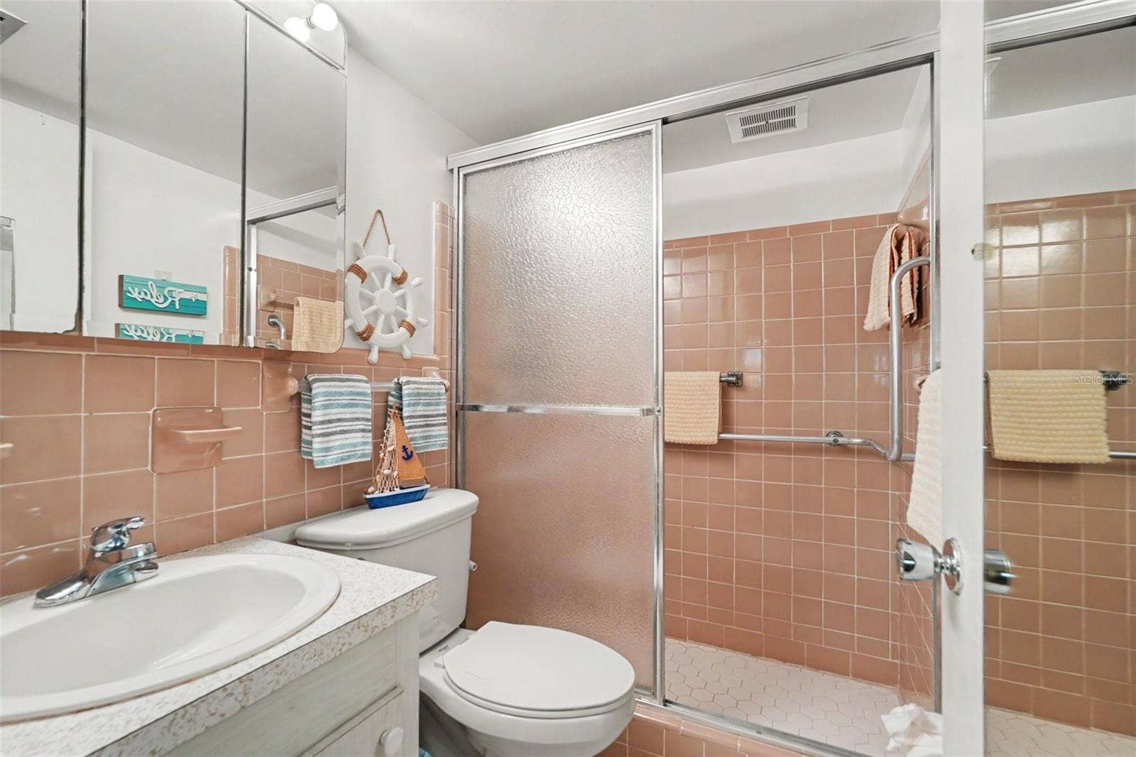 11201 80TH AVENUE, #209, Seminole, FL 33772 Private en-suite primary bathroom with full size shower
