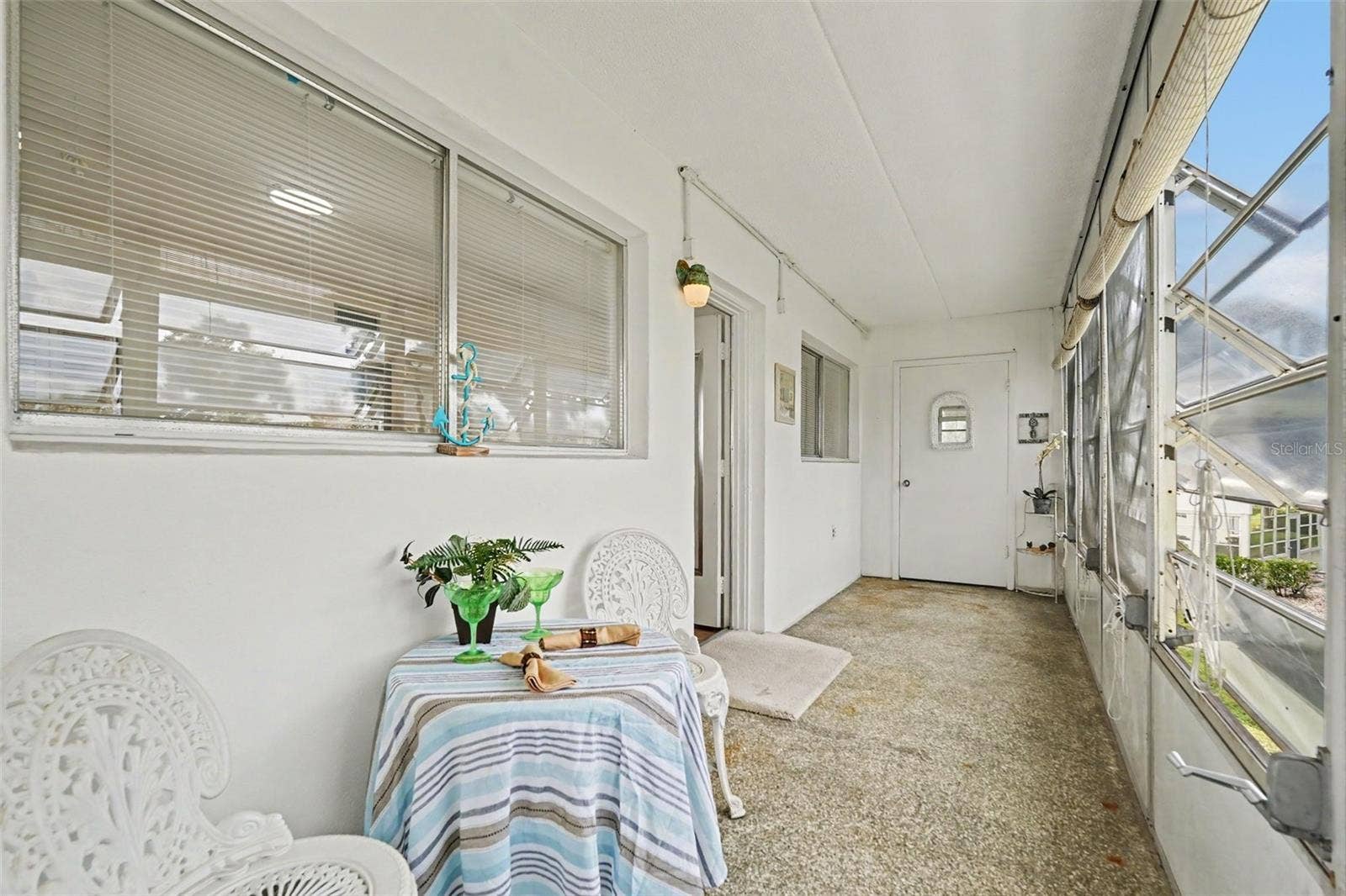 11201 80TH AVENUE, #209, Seminole, FL 33772 Awesome Florida sun porch to enjoy with water view of the pond and fountain!
