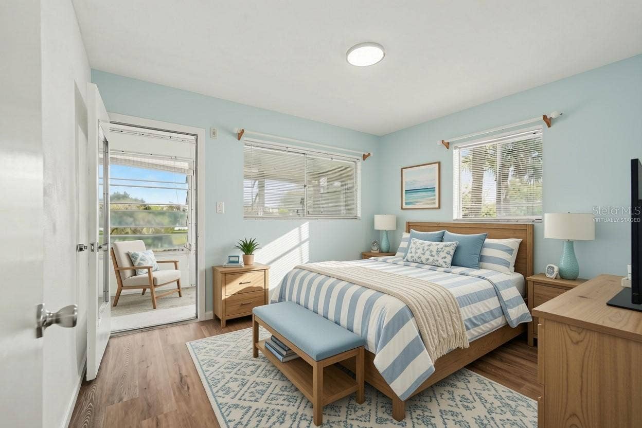 11201 80TH AVENUE, #209, Seminole, FL 33772 Second bedroom has access to the rear sunroom! Virtually staged