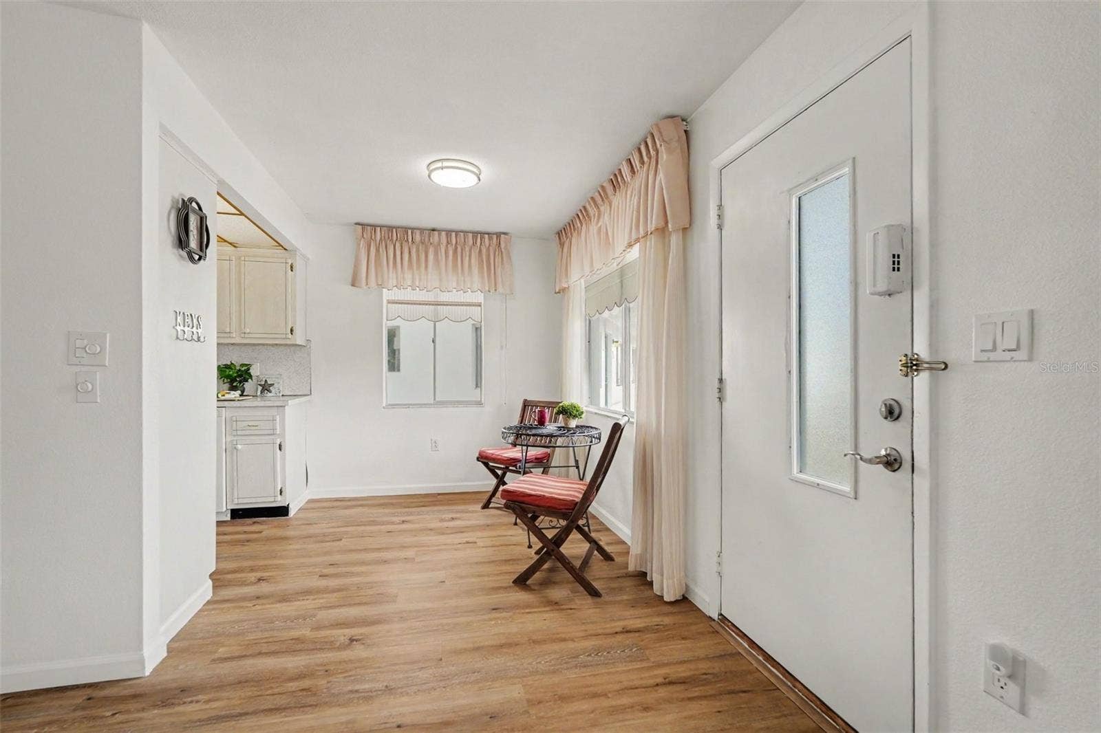 11201 80TH AVENUE, #209, Seminole, FL 33772 Cozy dining area just off the galley kitchen