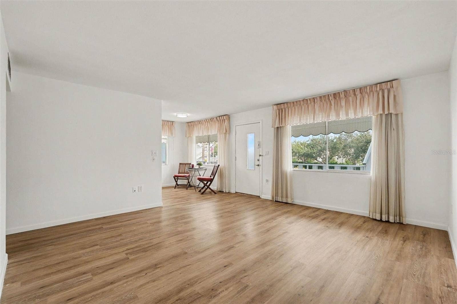 11201 80TH AVENUE, #209, Seminole, FL 33772 New flooring greets you in this large sun filled corner unit condo!