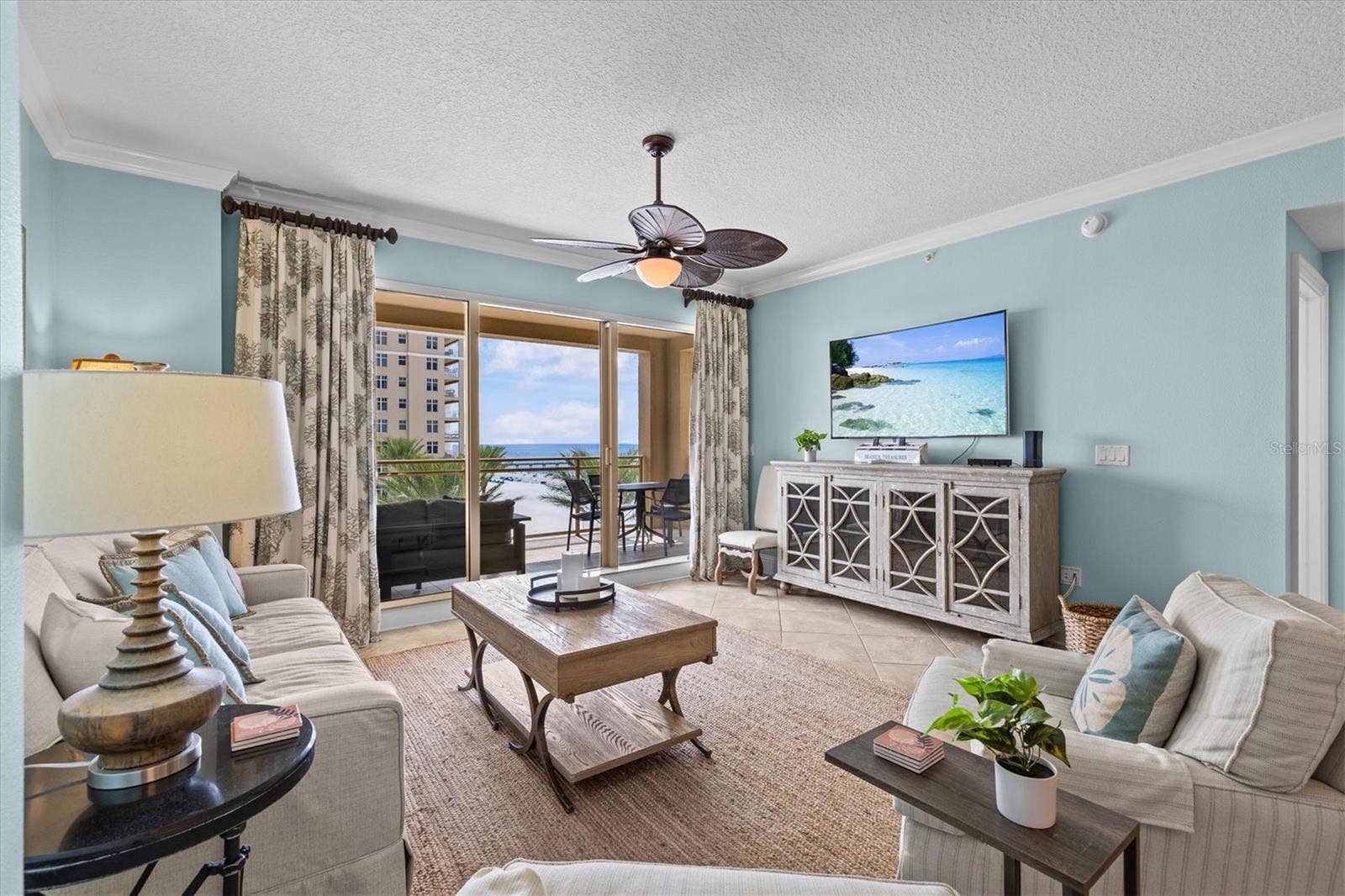 Bright, inviting living space with tile flooring and offered fully furnished.
