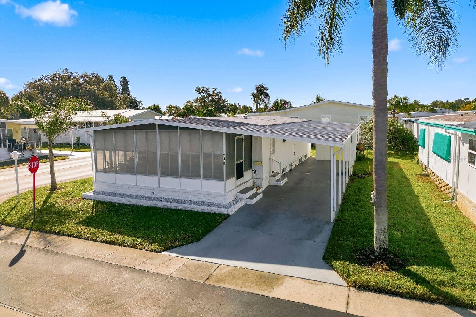 203 SEAGULL DRIVE, Tarpon Springs, FL 34689 Front Exterior and Covered Patio