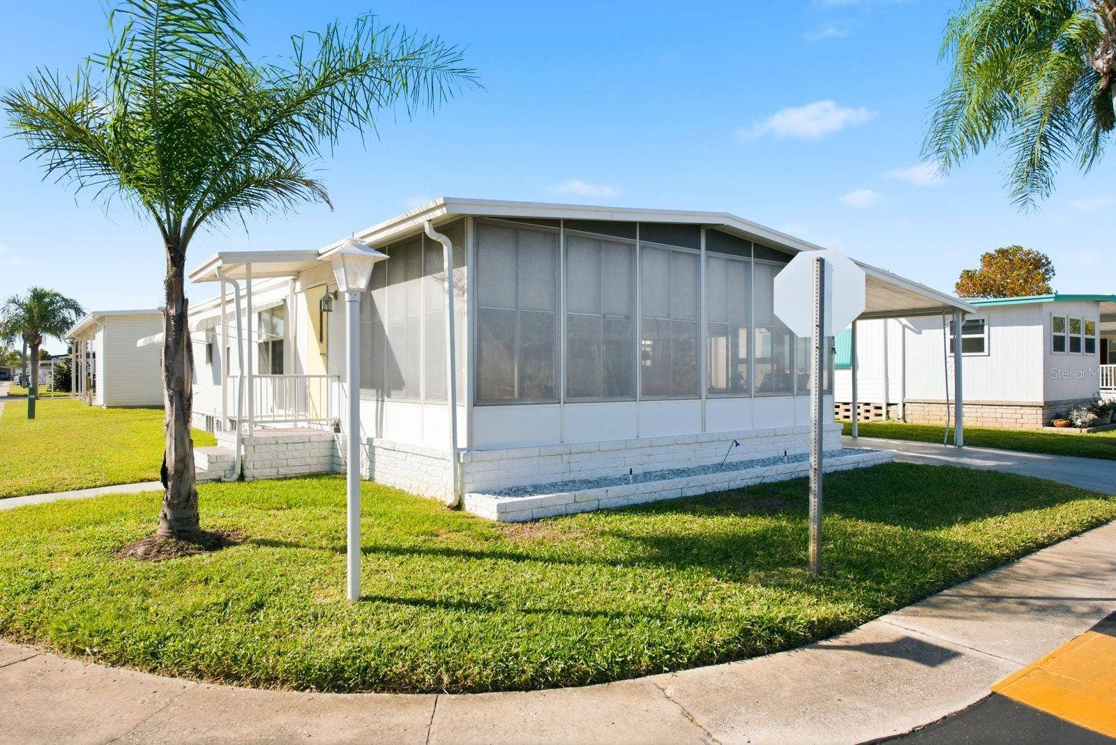 203 SEAGULL DRIVE, Tarpon Springs, FL 34689 Side and Front Exterior