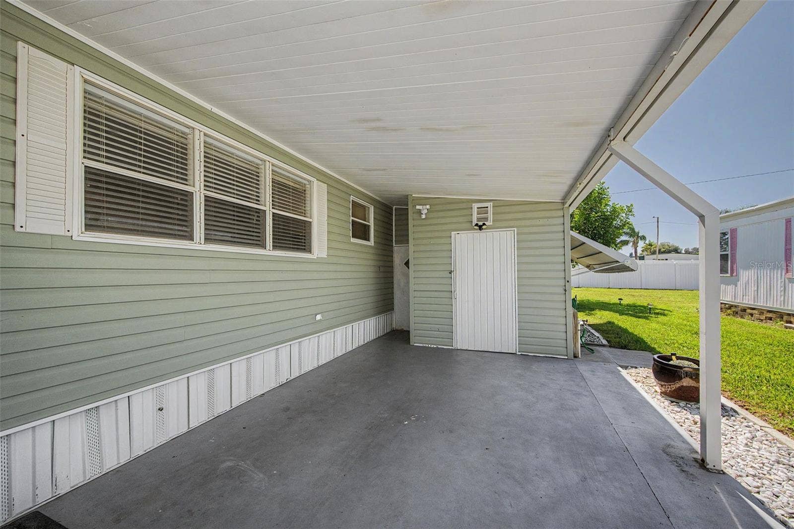 18 DRURY LANE, Tarpon Springs, FL 34689 widened carport