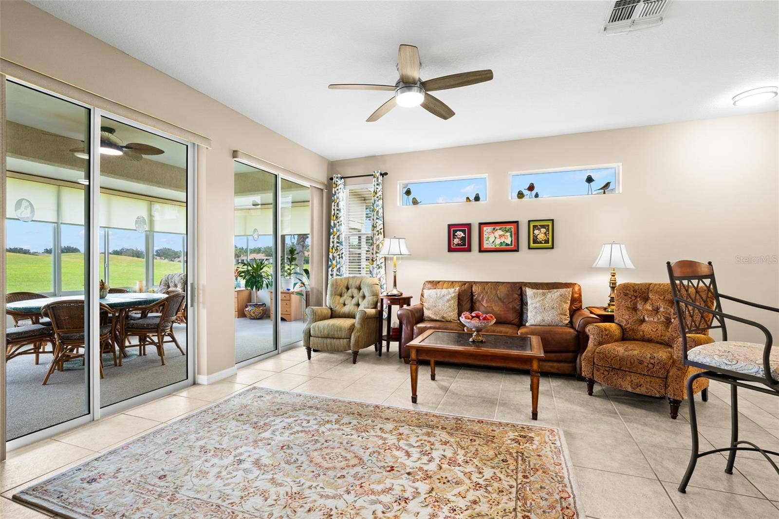 2057 INVERNESS GREENS DRIVE, Sun City Center, FL 33573 Living Room and Florida Room