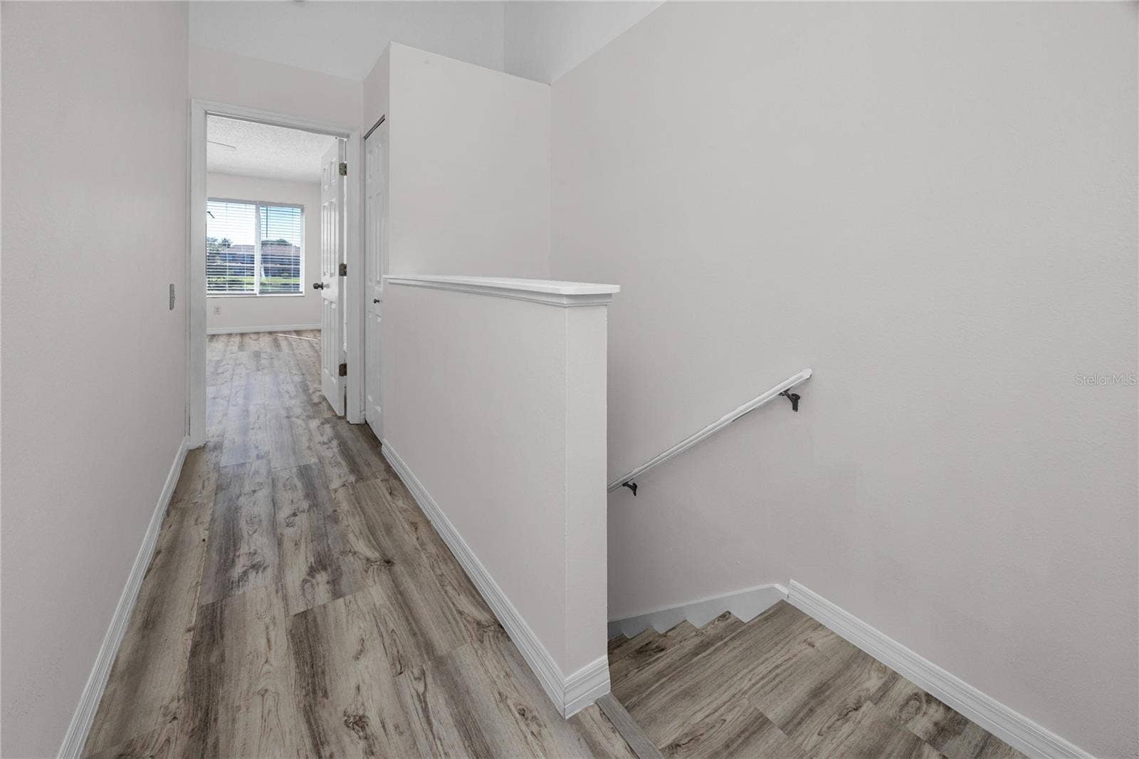 6229 BAYSIDE KEY DRIVE, Tampa, FL 33615 Upstairs Hallway with LVP -6229 Bayside Key Dr, Tampa, FL 33615