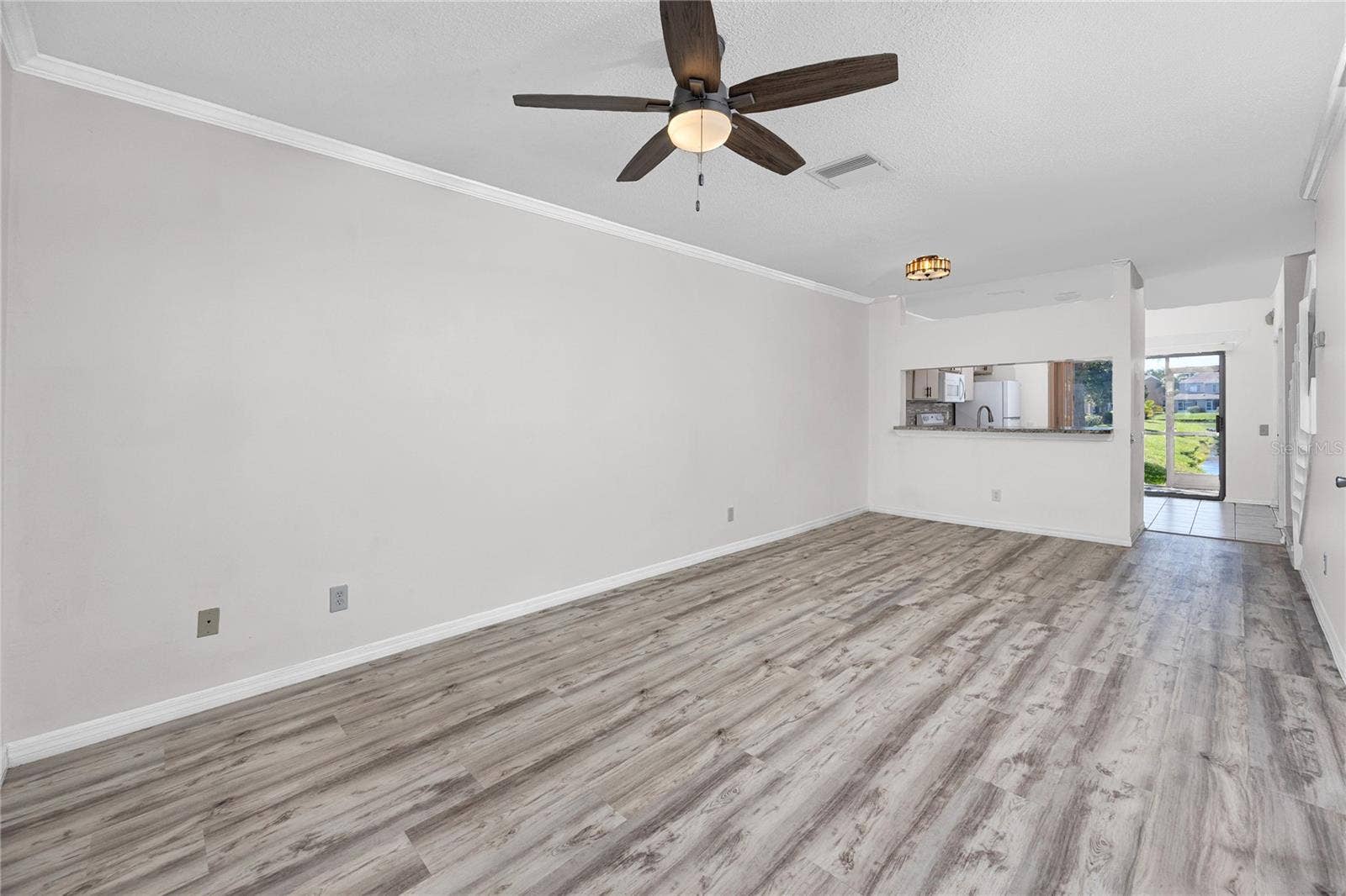 6229 BAYSIDE KEY DRIVE, Tampa, FL 33615 Open concept living area with Luxury Vinyl Plank -6229 Bayside Key Dr, Tampa, FL 33615