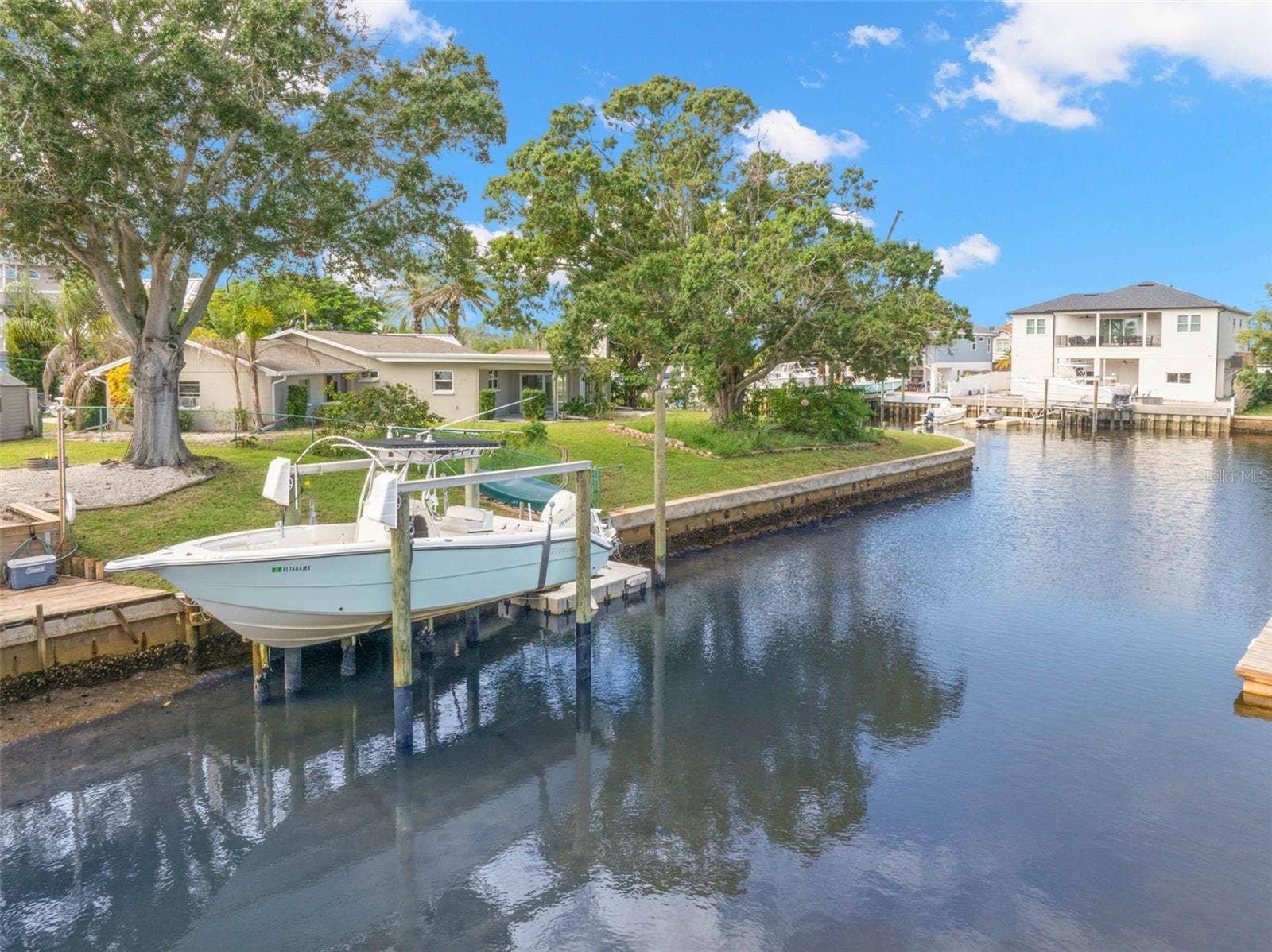 Set along a saltwater canal with Gulf access and no fixed bridges, the propertys 10,000-pound boat lift puts you just steps from getting out on the water.