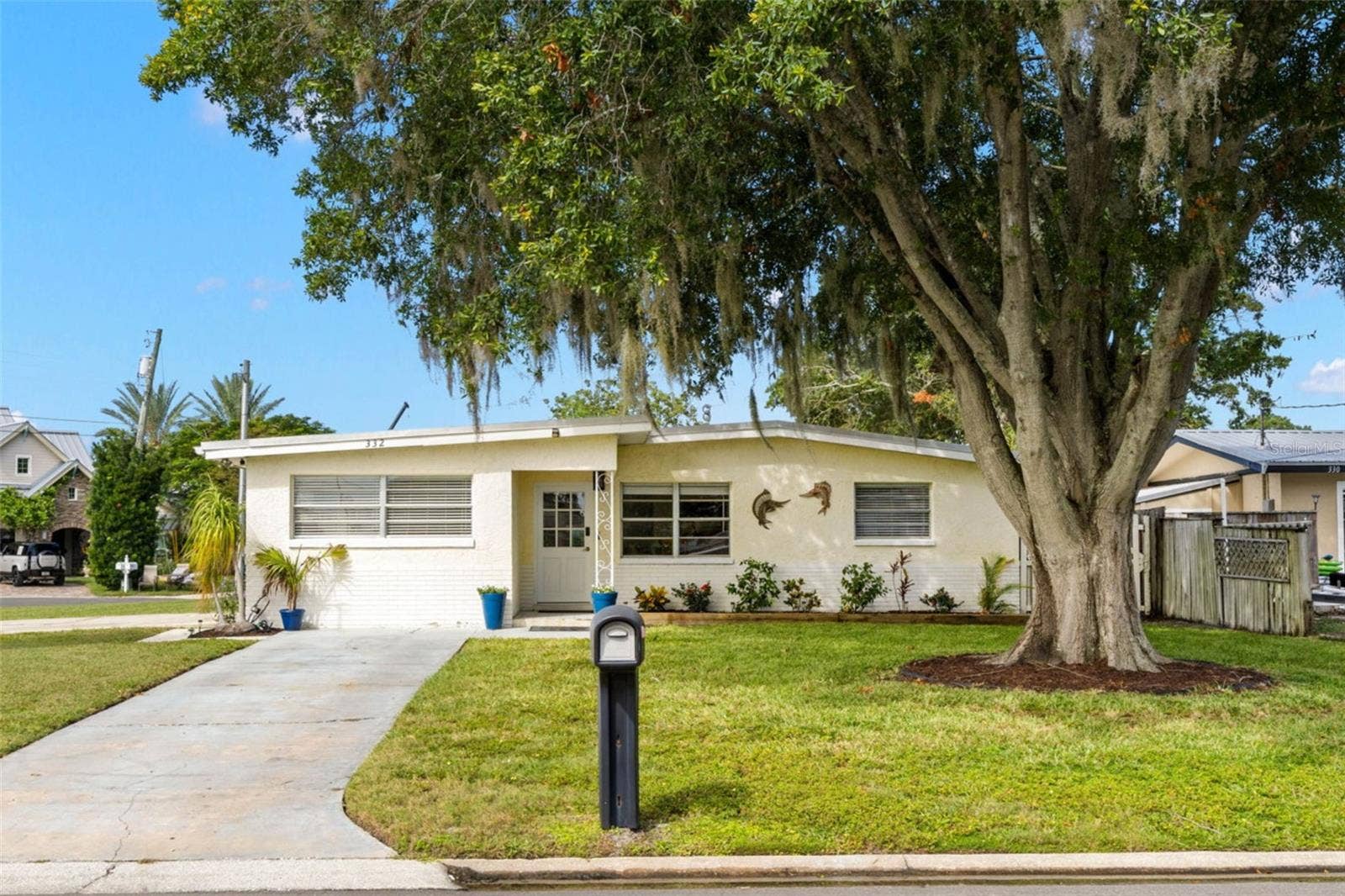 Set on an impressive 11,800-square-foot (.27-acre) corner property spanning one full lot plus half of the adjoining lot, this 3-bedroom, 2-bath Palm Harbor waterfront home offers exceptional outdoor space beneath a magnificent mature oak.