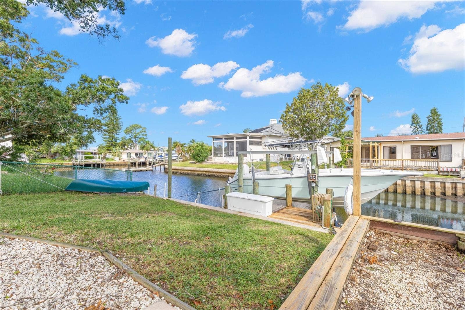 Boating starts in your own backyard, with canal frontage, private dockage, a boat lift, and direct access toward the Gulfall just steps from the lawn.