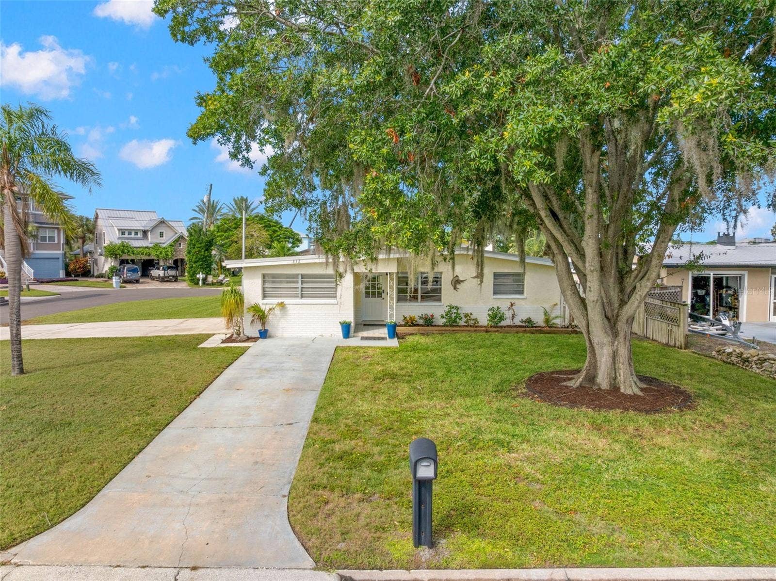 Set on a generous 11,800-square-foot corner property at the end of a cul-de-sac, the home enjoys a broad front lawn, mature shade tree, and plenty of breathing room from the street.