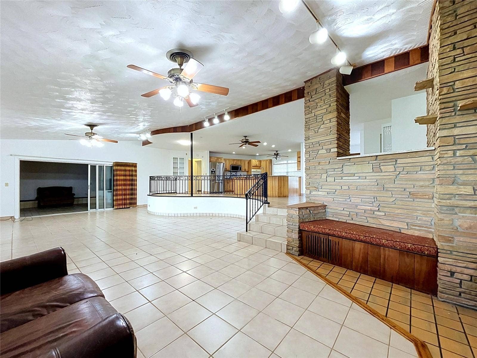 1348 EDGEWATER BEACH DRIVE, Lakeland, FL 33805 Living area with tile flooring and kitchen access