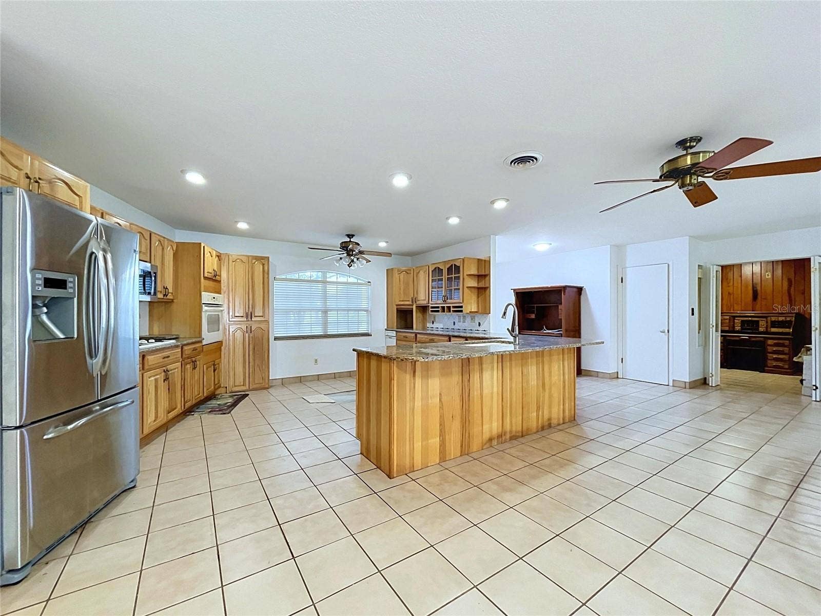 1348 EDGEWATER BEACH DRIVE, Lakeland, FL 33805 Kitchen with center island and tile flooring