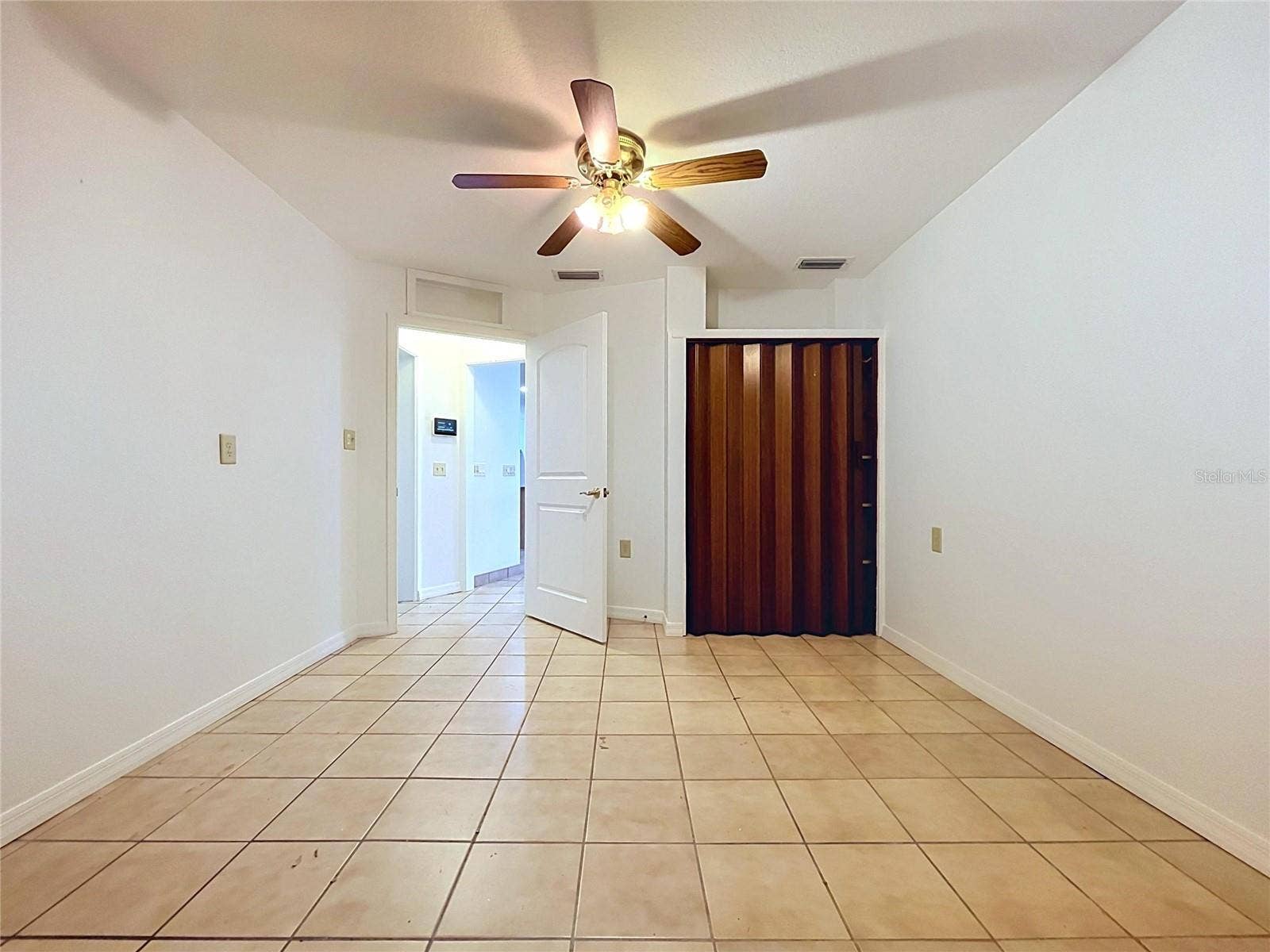 1348 EDGEWATER BEACH DRIVE, Lakeland, FL 33805 Bonus room with tile flooring and ceiling fan