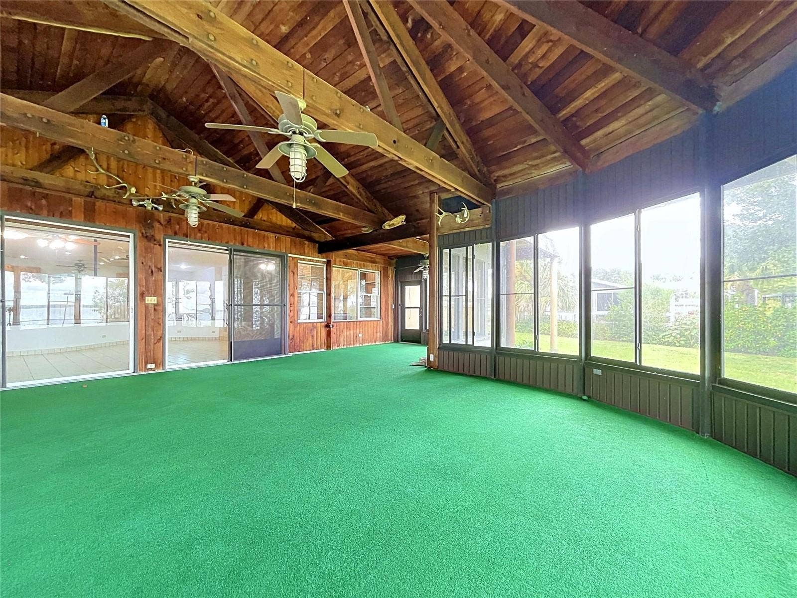1348 EDGEWATER BEACH DRIVE, Lakeland, FL 33805 Lanai with large windows and vaulted wood ceiling