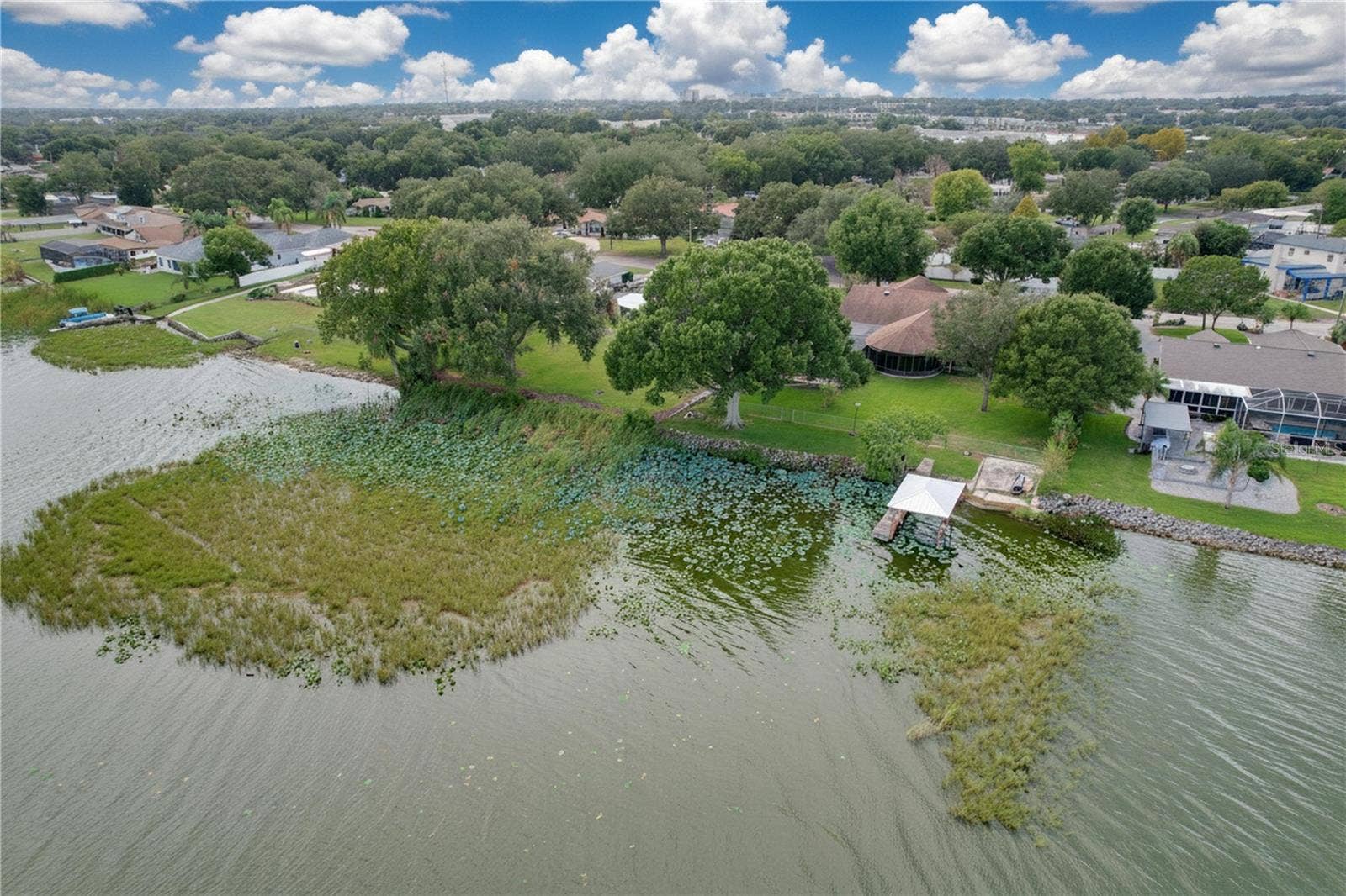 1348 EDGEWATER BEACH DRIVE, Lakeland, FL 33805 Aerial view from water of backyard, dock, and ramp