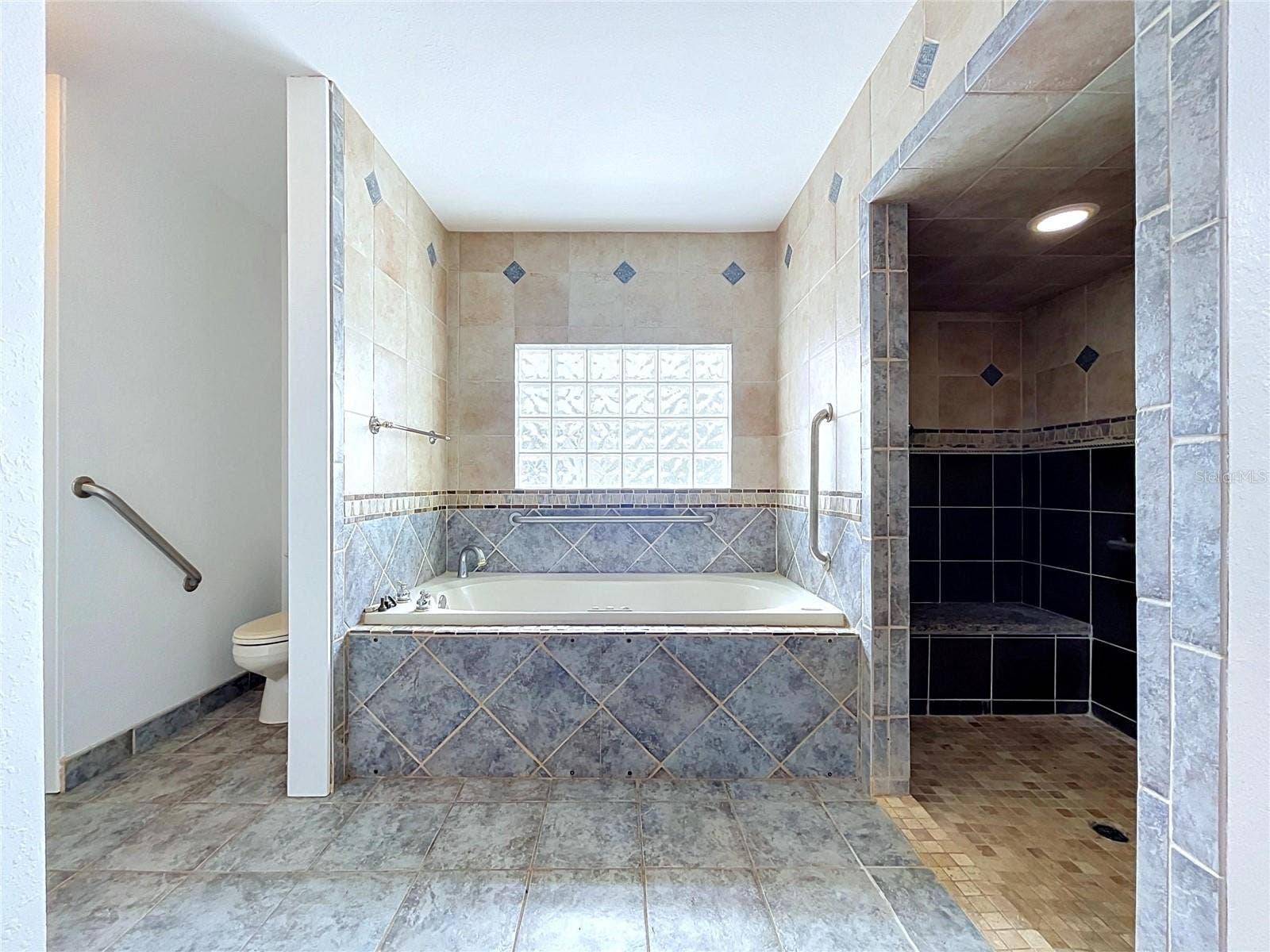 1348 EDGEWATER BEACH DRIVE, Lakeland, FL 33805 Bathroom 3 with bathtub and separate shower