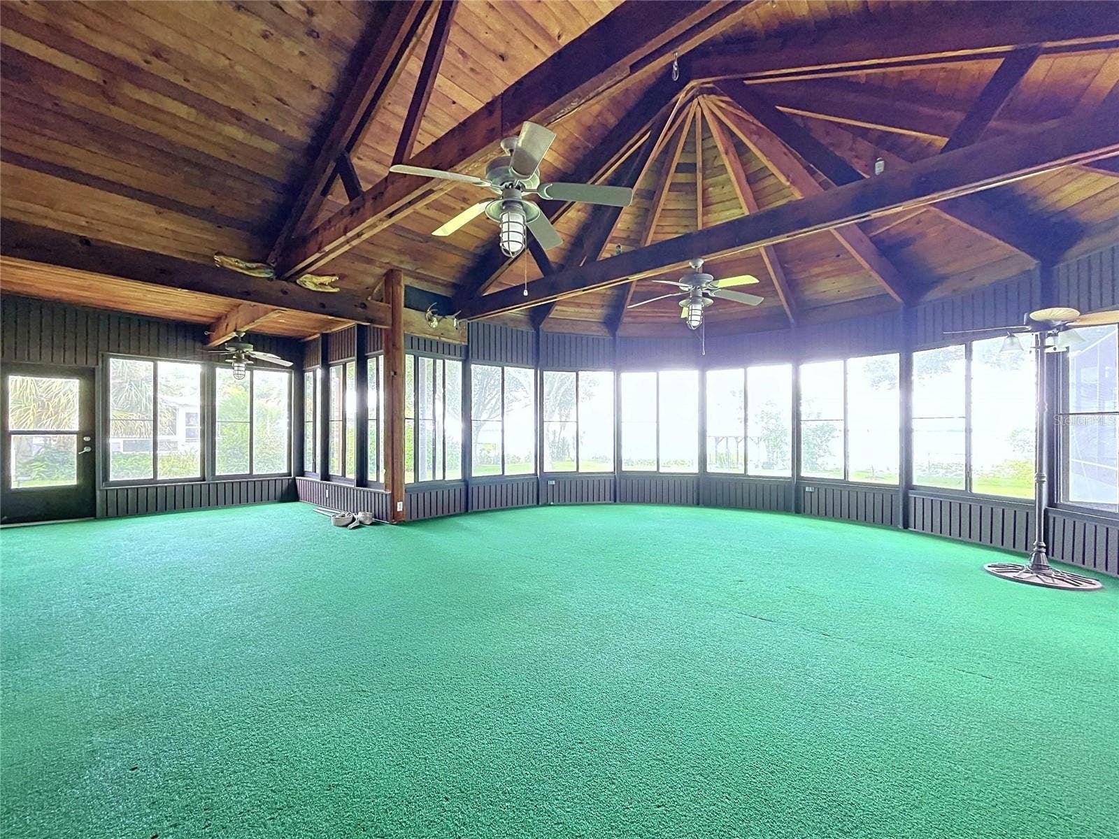 1348 EDGEWATER BEACH DRIVE, Lakeland, FL 33805 Lanai with large windows and vaulted wood ceiling
