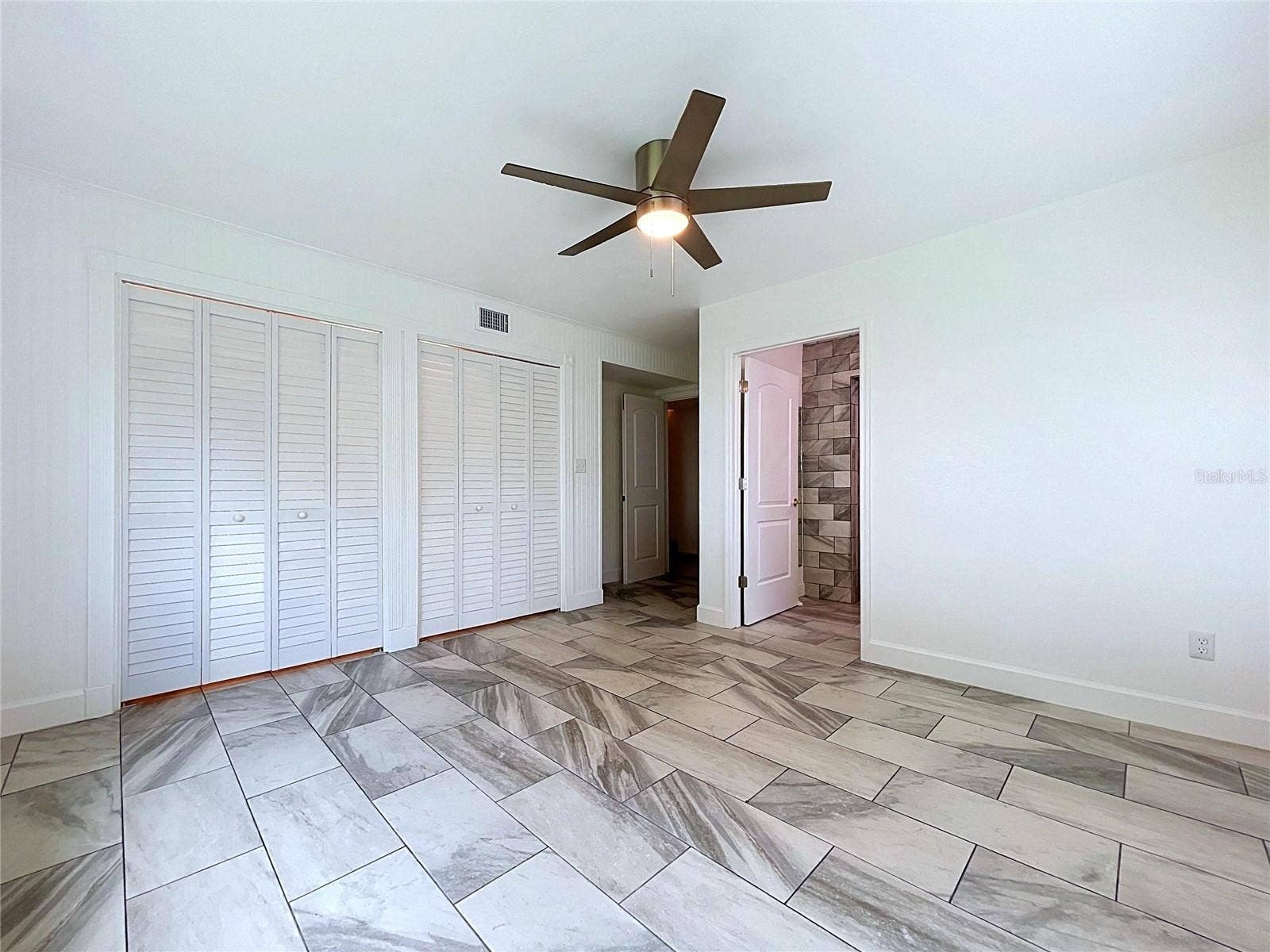 1348 EDGEWATER BEACH DRIVE, Lakeland, FL 33805 Bedroom 1 showing closet and doorway