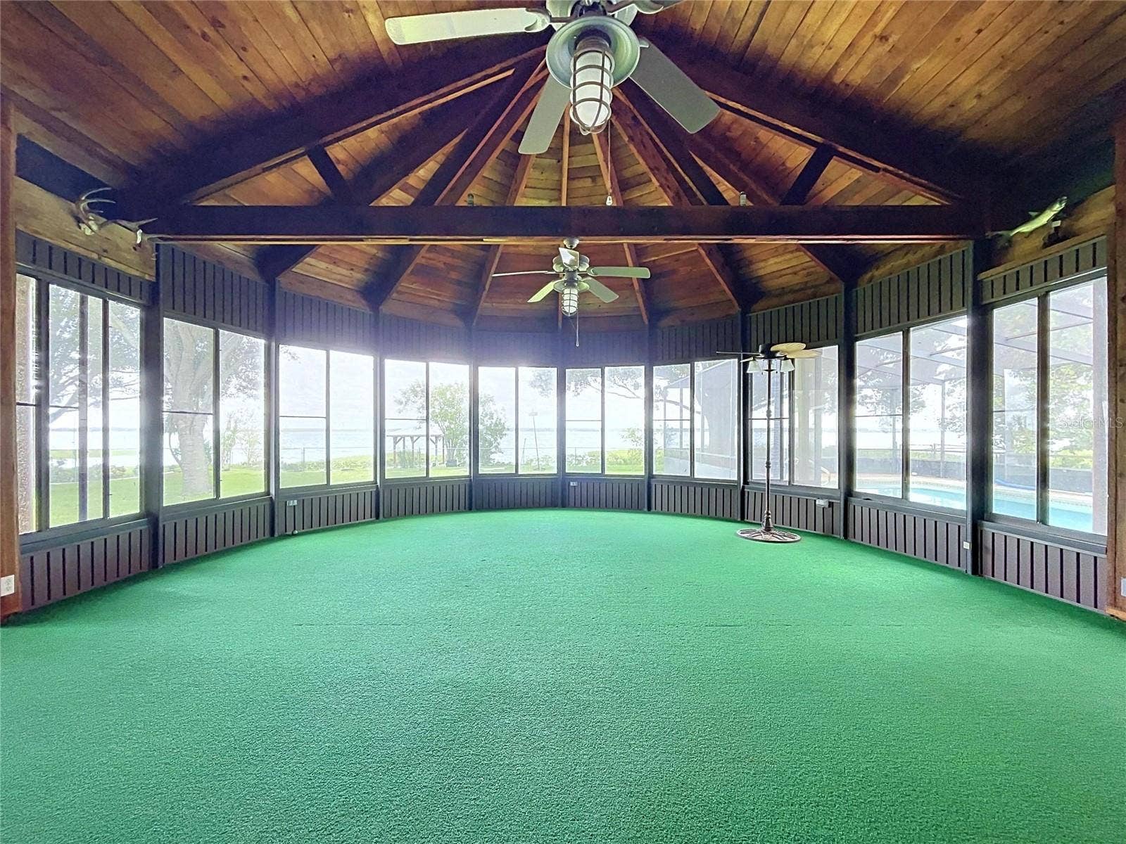 1348 EDGEWATER BEACH DRIVE, Lakeland, FL 33805 Lanai with large windows and vaulted wood ceiling
