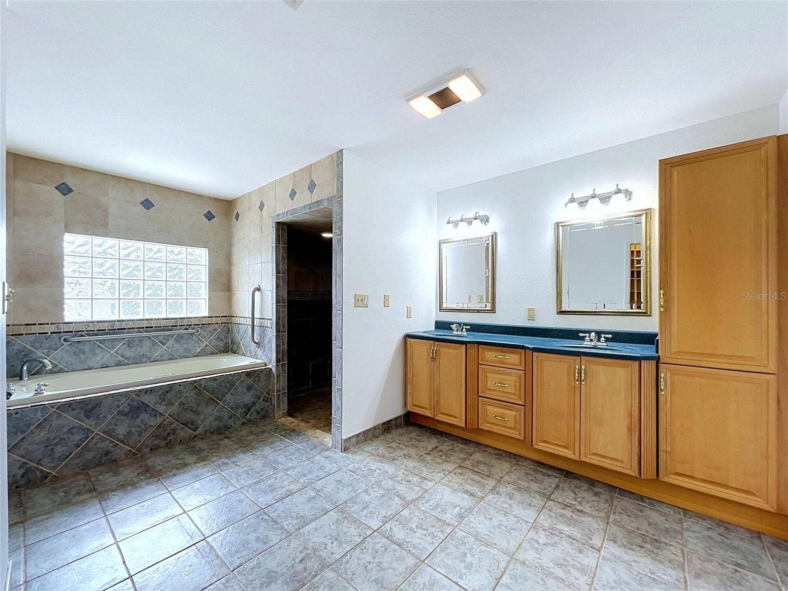 1348 EDGEWATER BEACH DRIVE, Lakeland, FL 33805 Bathroom 3 vanity with cabinetry and mirrors