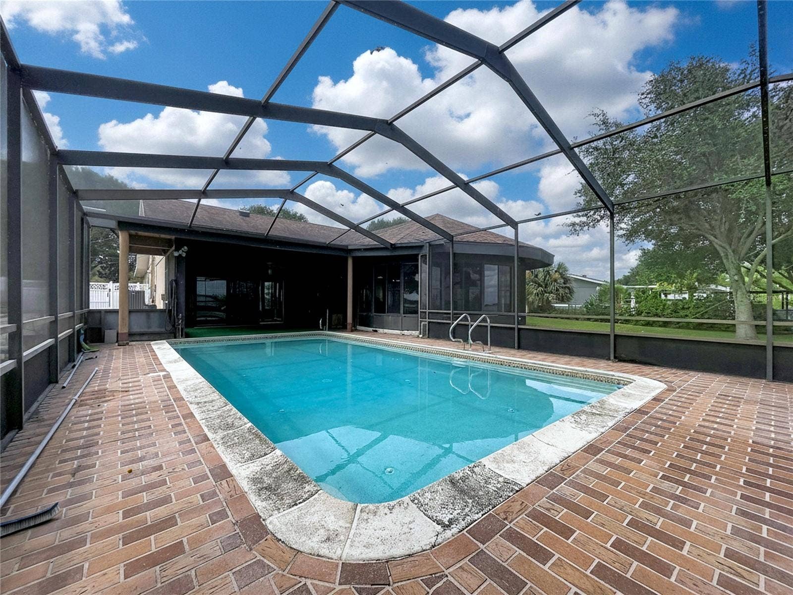 1348 EDGEWATER BEACH DRIVE, Lakeland, FL 33805 In-ground pool with screened enclosure