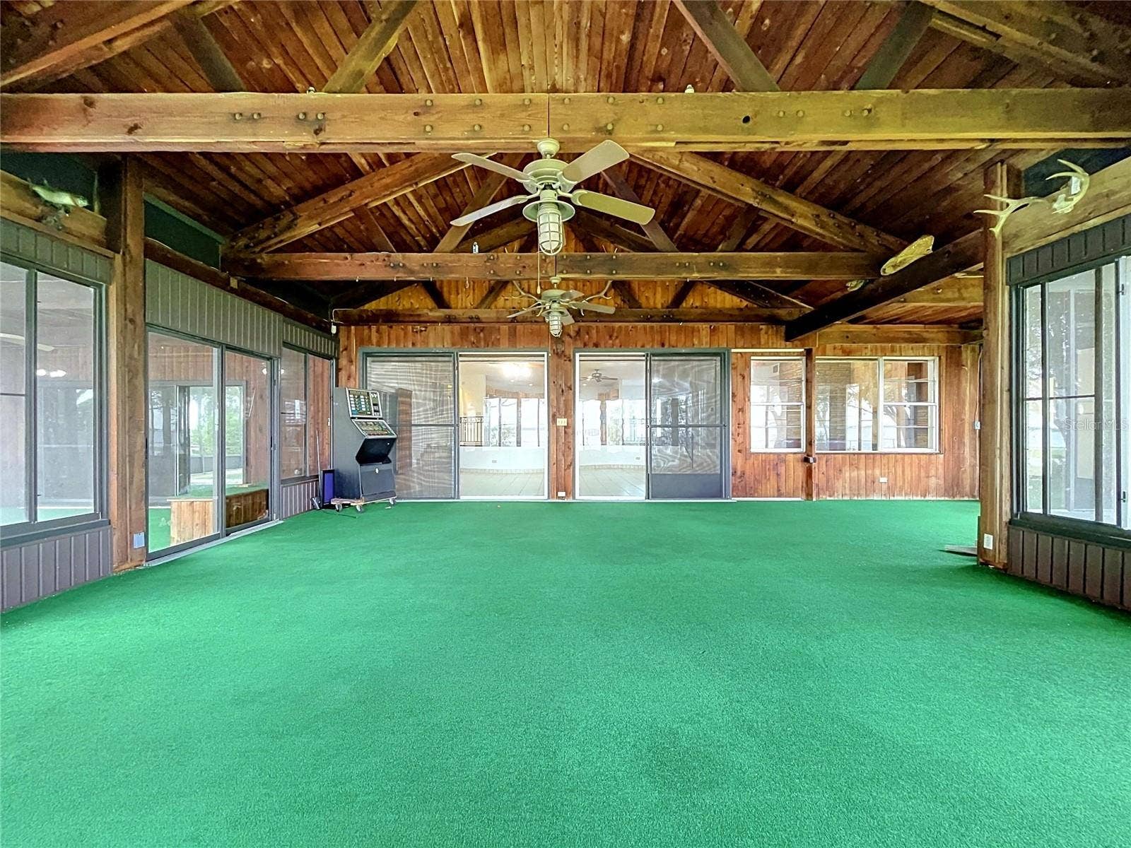 1348 EDGEWATER BEACH DRIVE, Lakeland, FL 33805 Lanai with large windows and vaulted wood ceiling