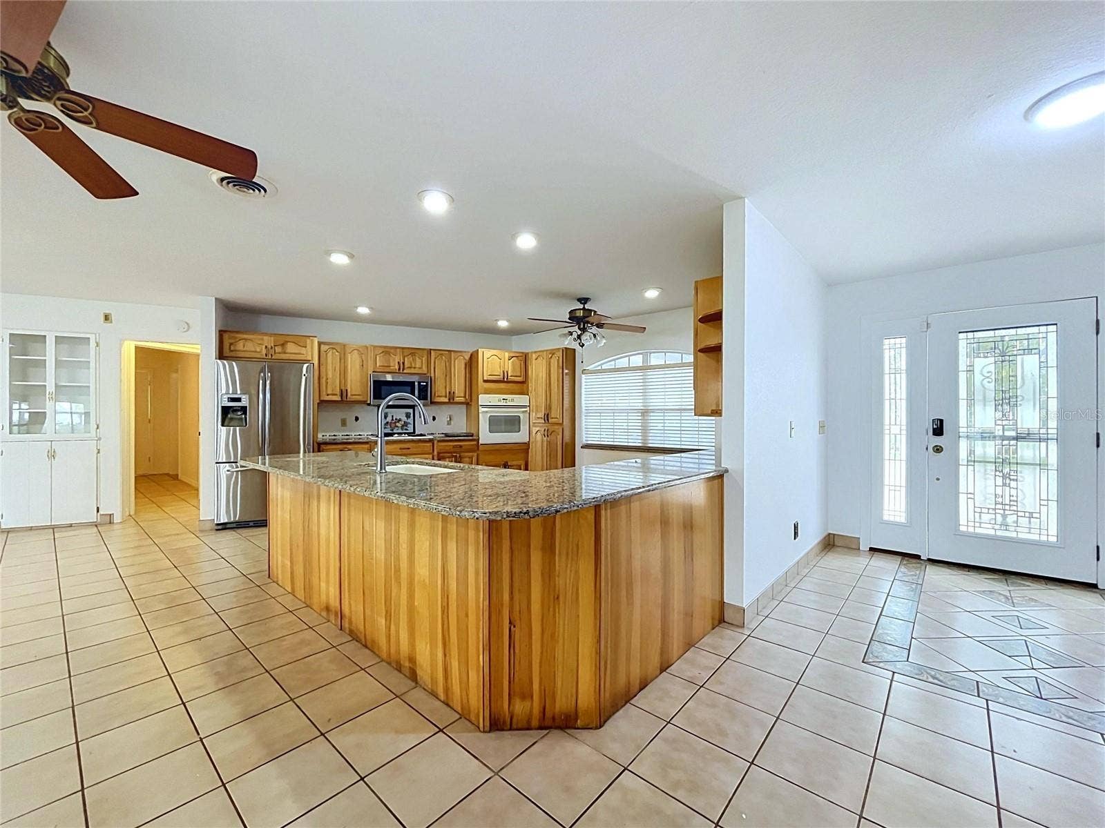 1348 EDGEWATER BEACH DRIVE, Lakeland, FL 33805 Kitchen with center island and adjoining living area