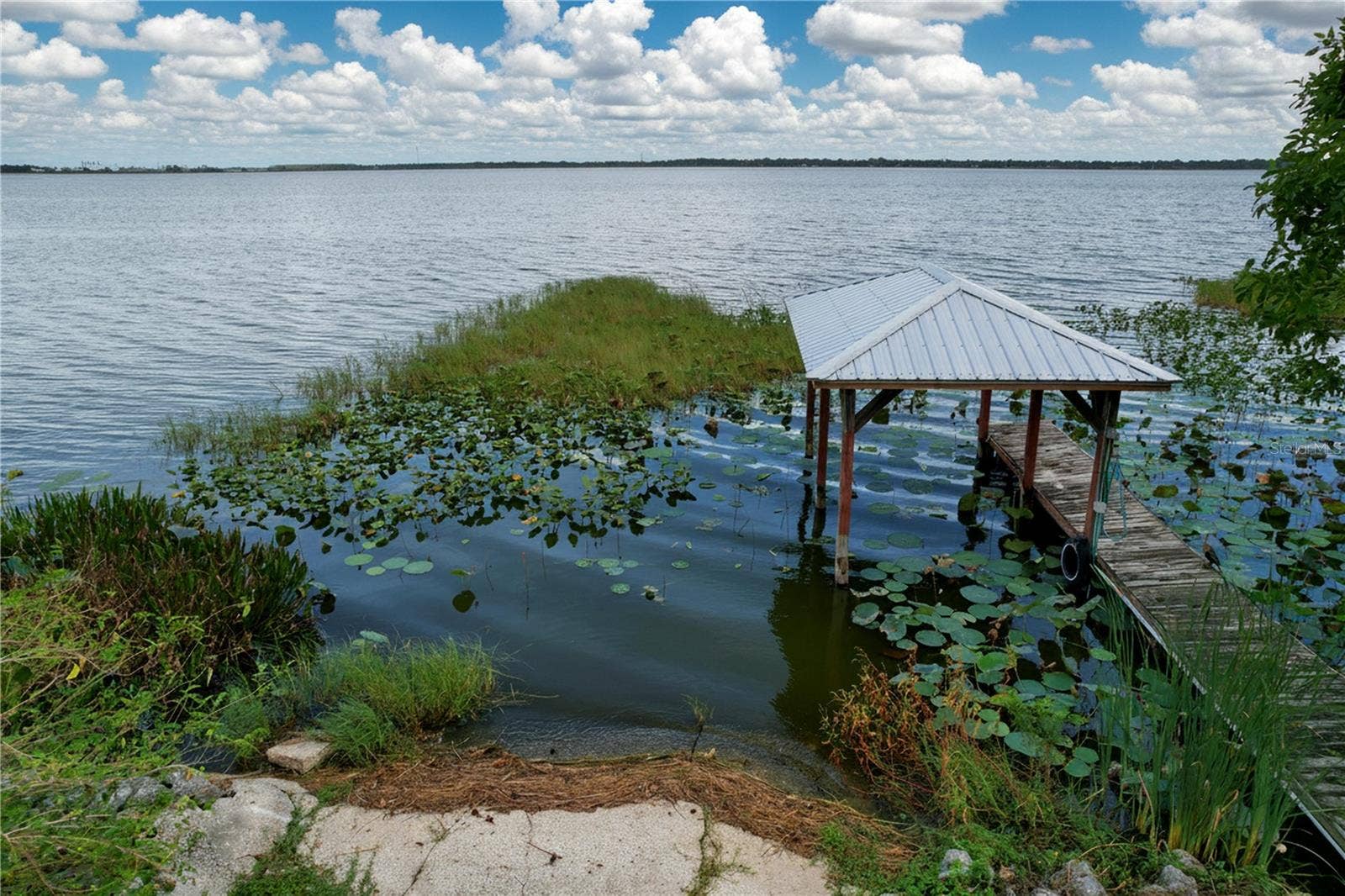 1348 EDGEWATER BEACH DRIVE, Lakeland, FL 33805 Lakefront view and dock and ramp