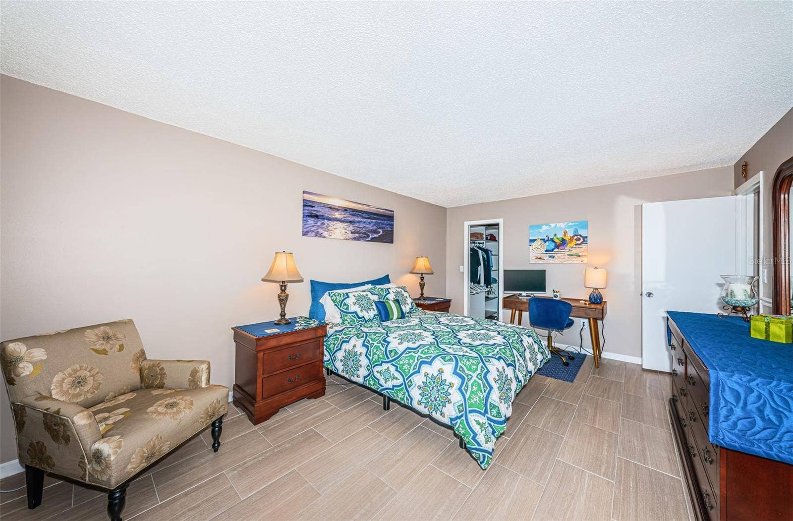 Primary bedroom with walk-in closet
