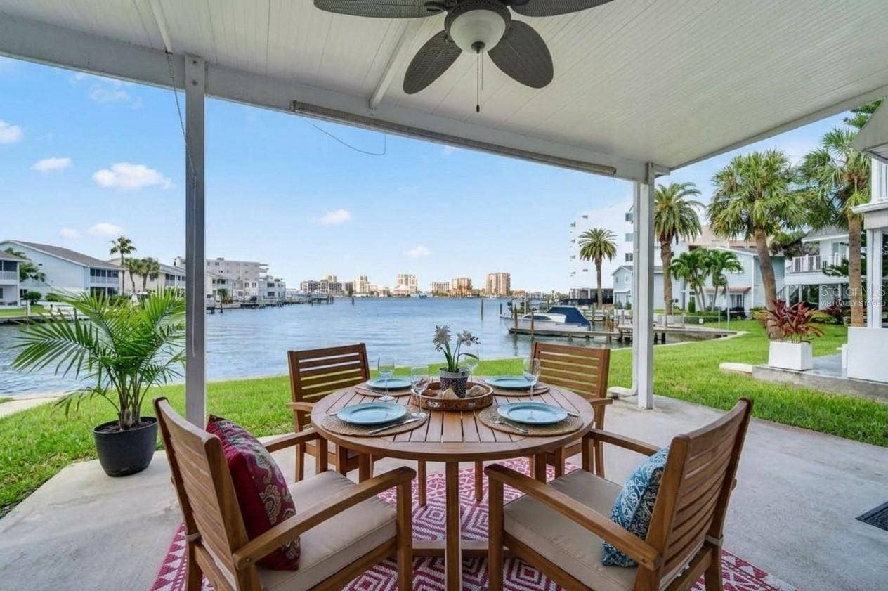 400 LARBOARD WAY, #106, Clearwater, FL 33767 Virtually Staged Outdoor patio for dining
