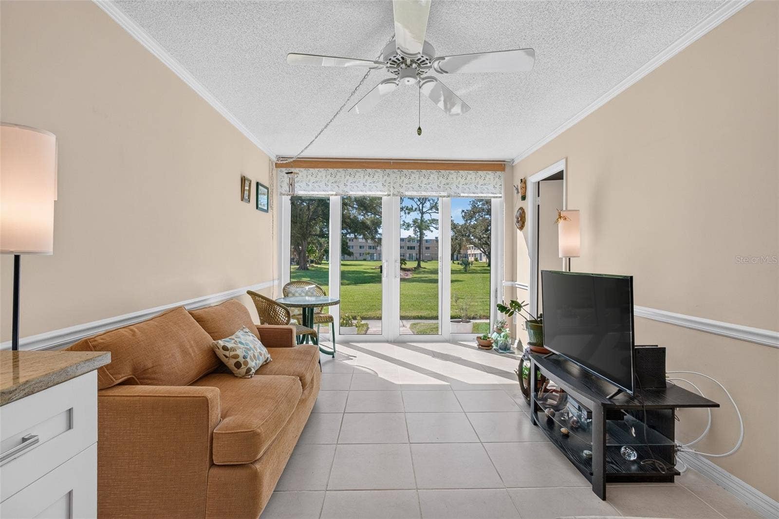 5095 BAY STREET NE, #104, St Petersburg, FL 33703 Florida room with new sliders