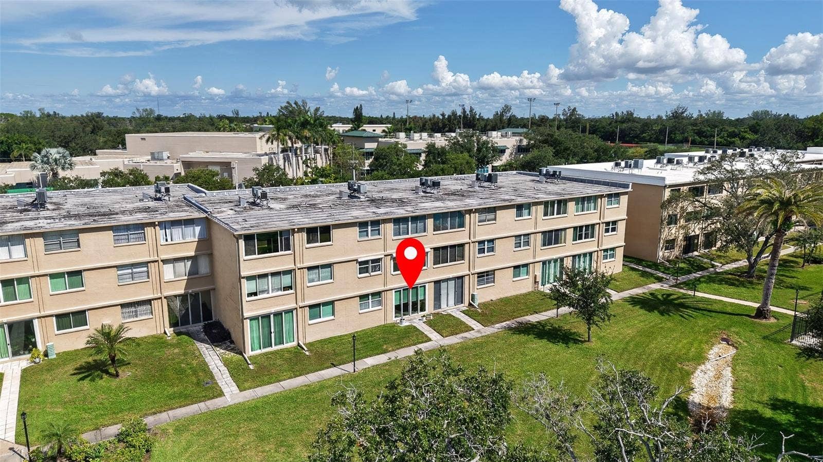 5095 BAY STREET NE, #104, St Petersburg, FL 33703 View of condo and courtyard with sidewalks