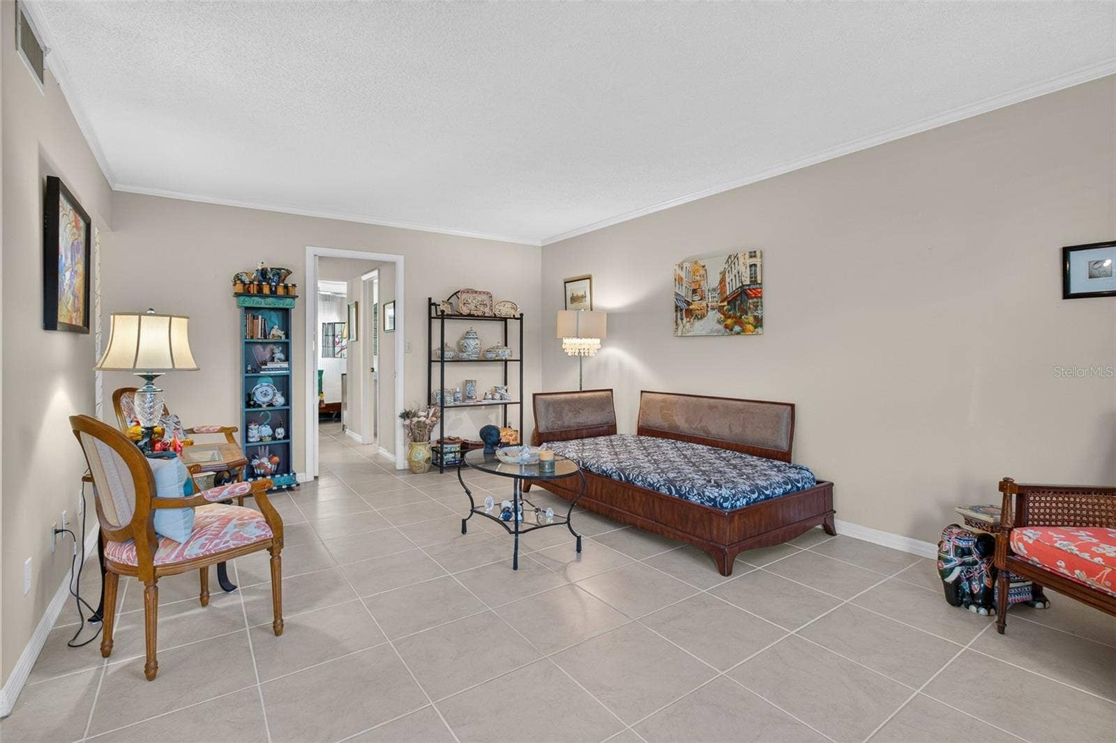 5095 BAY STREET NE, #104, St Petersburg, FL 33703 Living room with doorway to ensuite bedroom