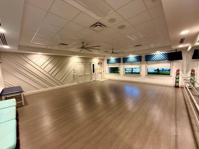 Studio with large storage that contains Pilates/gym weights and ping pong tables