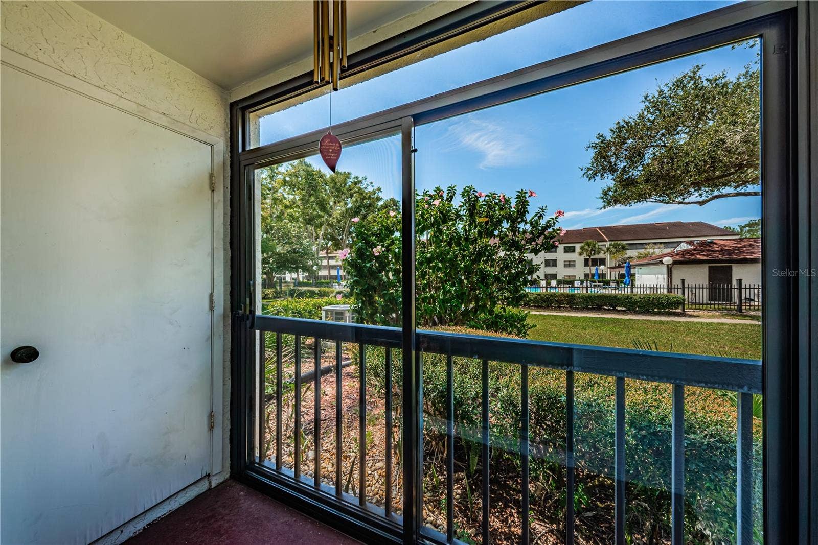 2591 COUNTRYSIDE BOULEVARD, #5106, Clearwater, FL 33761 Patio outside Primary Bedroom w/storage room