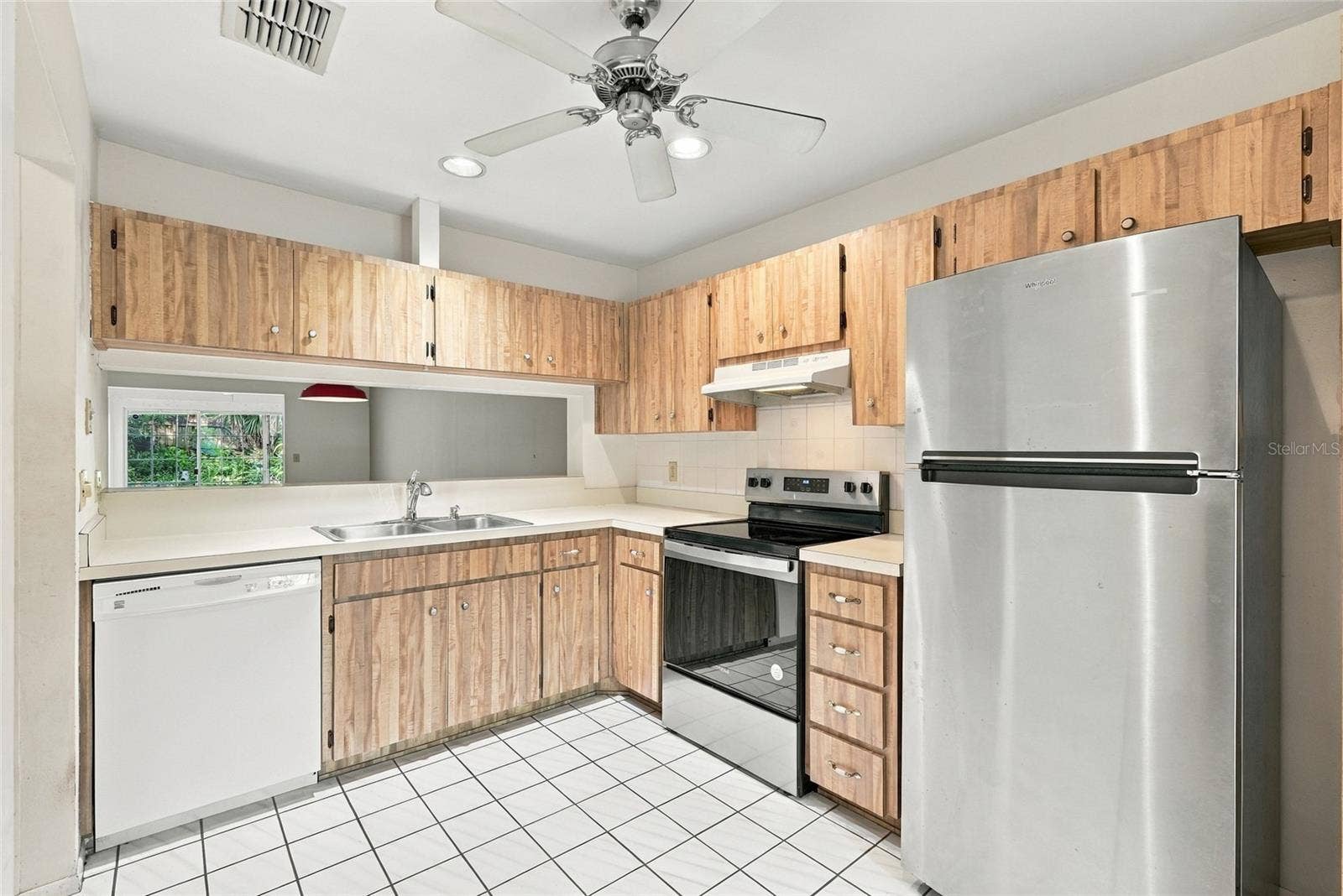 1111 THAYER STREET, #1111, Safety Harbor, FL 34695 Kitchen with pass through window to Dining Room
