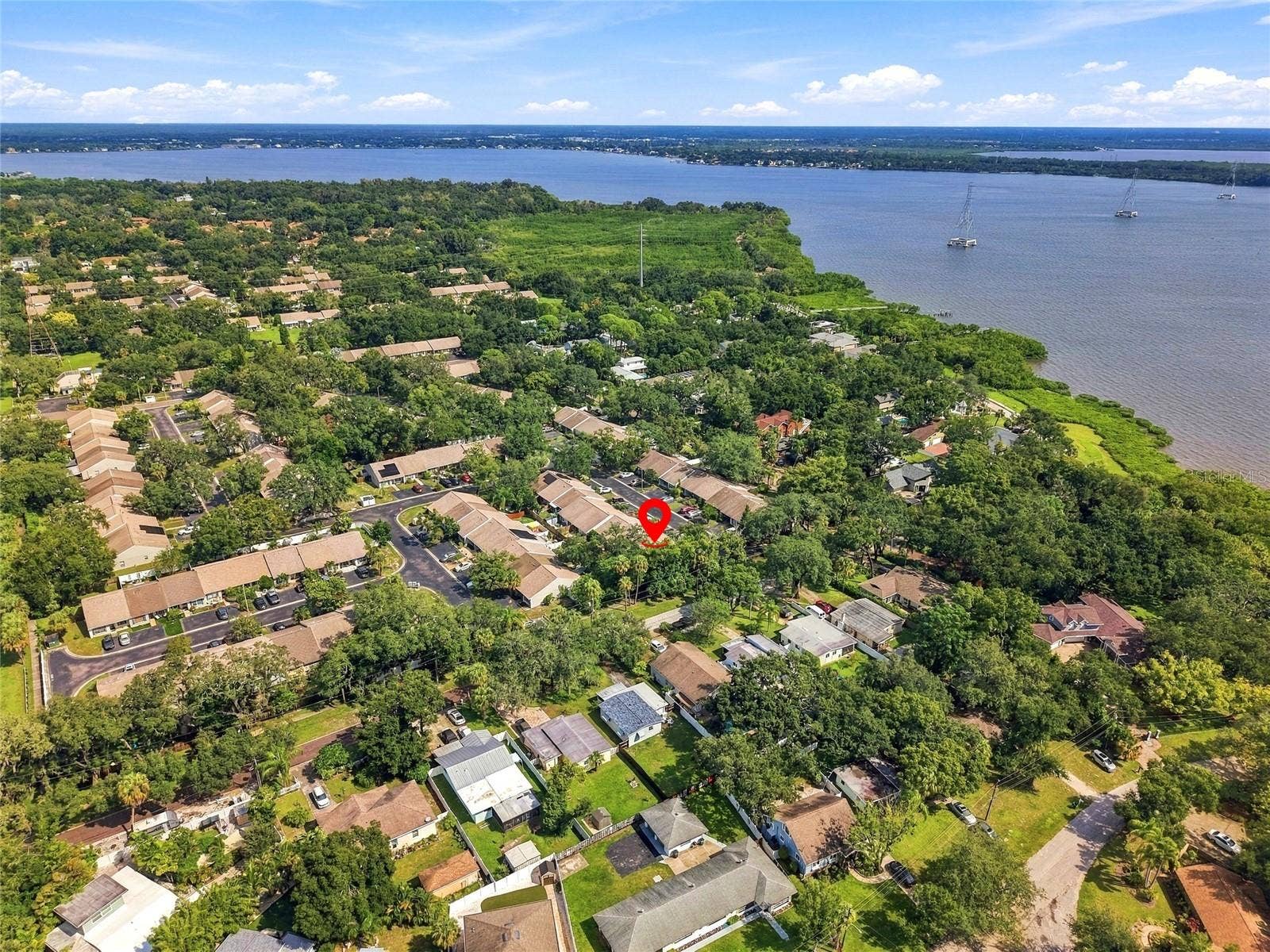 1111 THAYER STREET, #1111, Safety Harbor, FL 34695 Drone shot showing the proximity to Phillipe Parkway in the upper middle of the photo. It is a short 7 minute walk to the park.