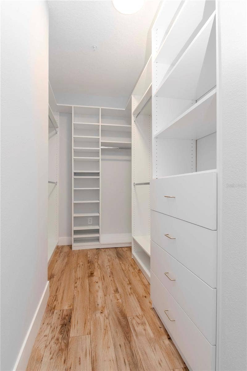 Primary Bedroom Custom Walk-In Closet by Closets By Design