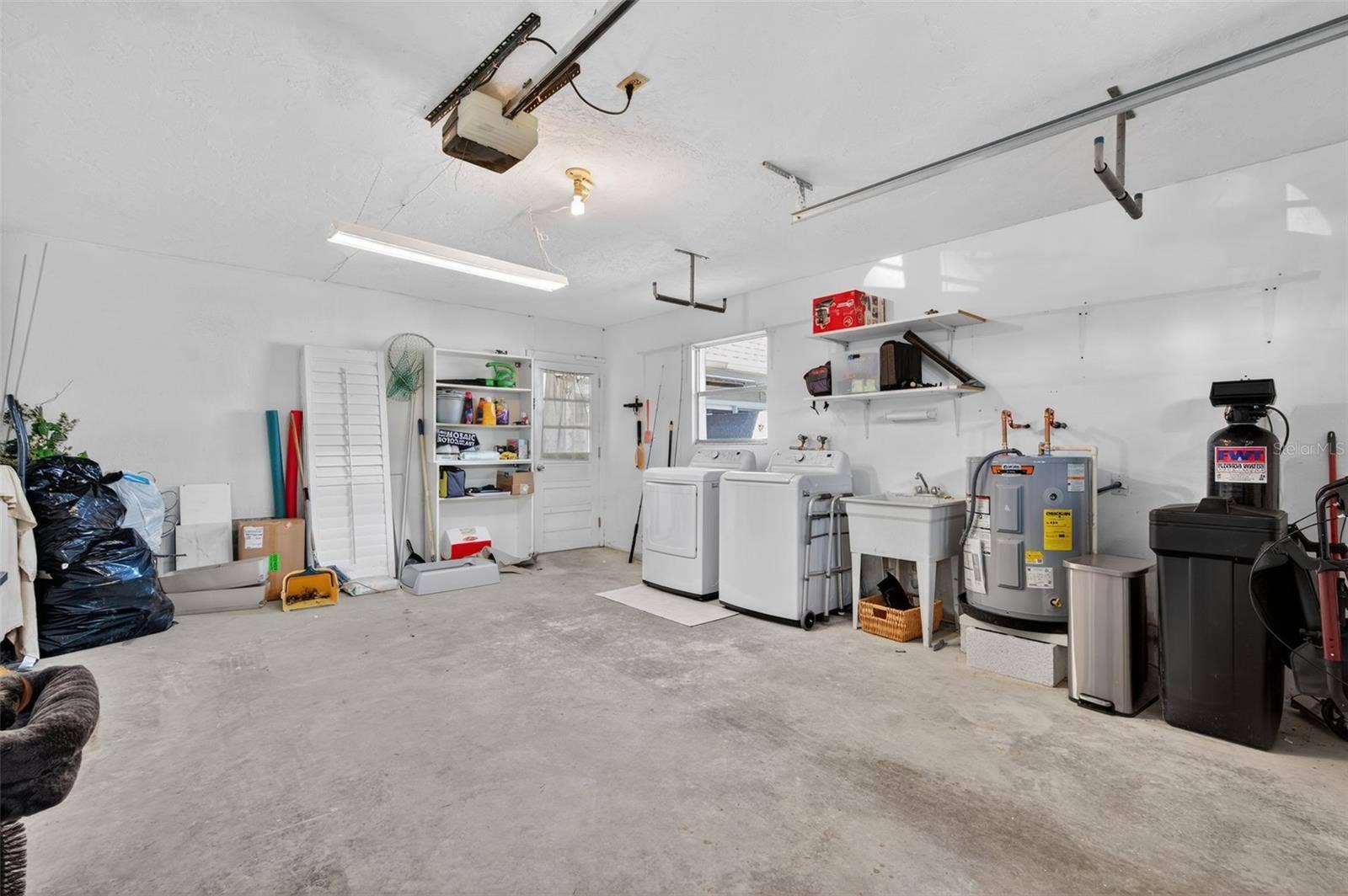 427 BOCA CIEGA POINT BOULEVARD N, St Petersburg, FL 33708 Garage with washer, dryer, and water softener