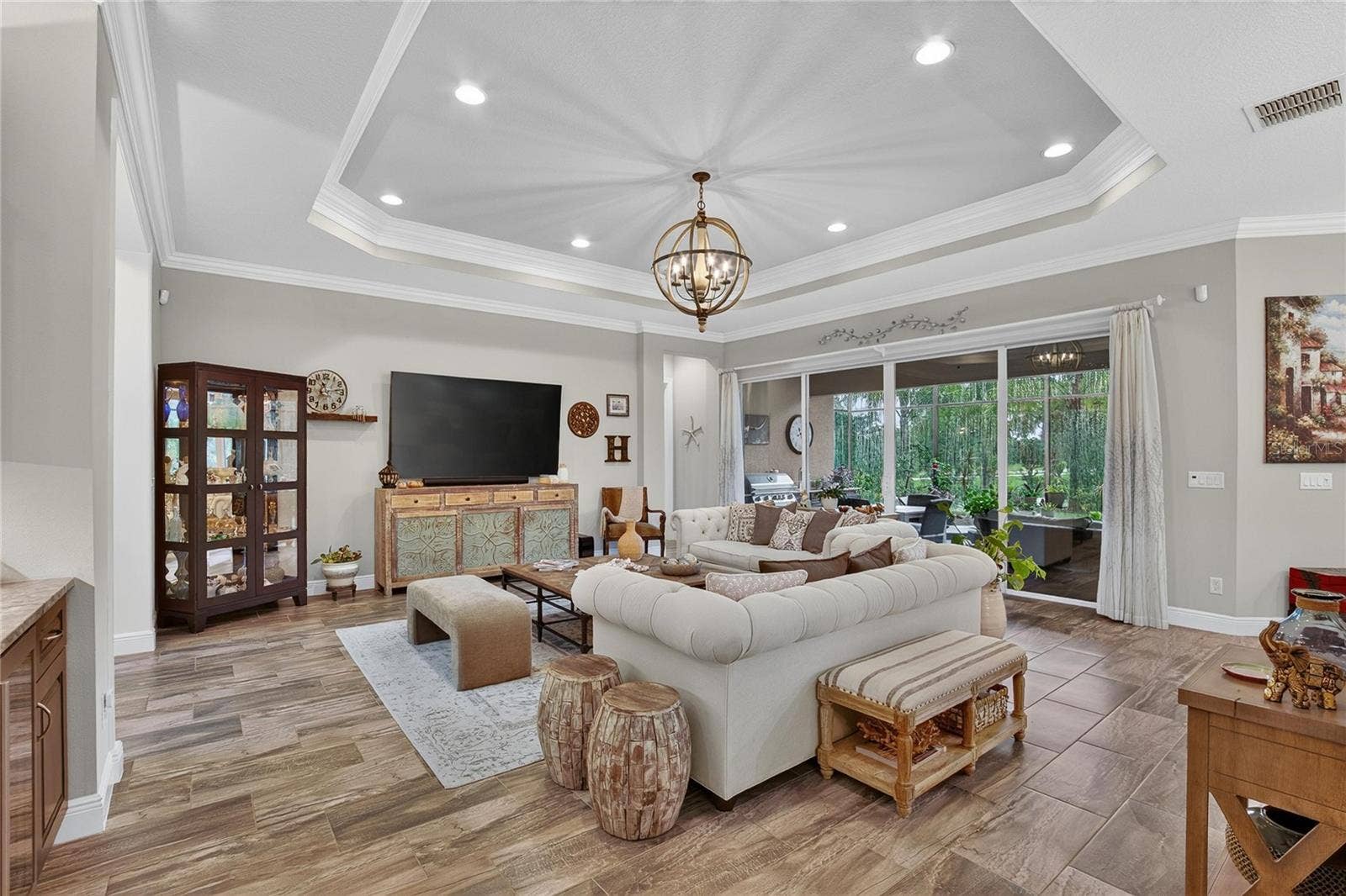 Great Room w/Tray Ceiling and Extensive Crown Molding