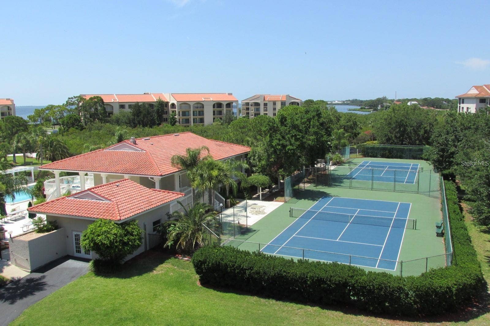 1806 MARINER DRIVE, #318, Tarpon Springs, FL 34689 Tarpon Cove tennis courts, clubhouse and fitness center.