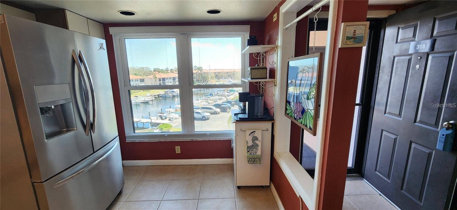 1806 MARINER DRIVE, #318, Tarpon Springs, FL 34689 As you step through your front door, the kitchen's view of the marina allows you to check on your boat every morning or check activity going on in The Cove as you make your first cup of coffee....