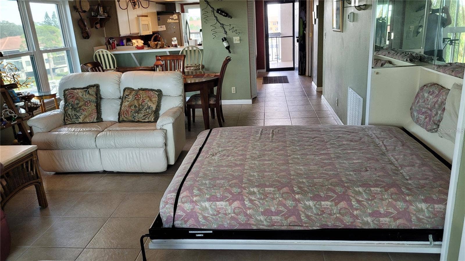 1806 MARINER DRIVE, #318, Tarpon Springs, FL 34689 The living area has a murphy bed for those occasions when you have more guests than the guest bedroom can accommodate.