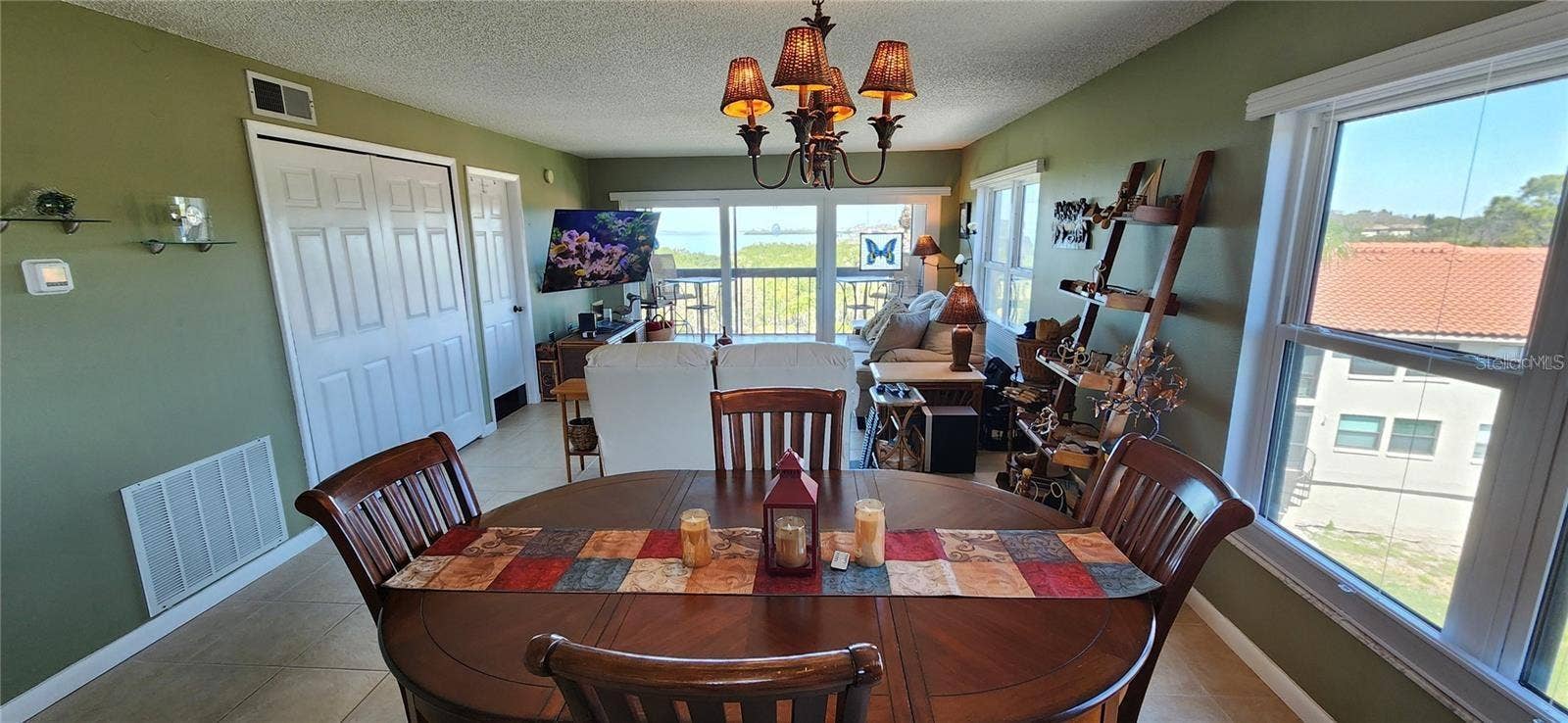 1806 MARINER DRIVE, #318, Tarpon Springs, FL 34689 This end unit has wrap around light and views from the open dining and living area to the balcony.