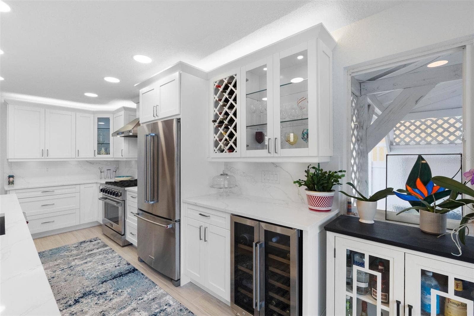 11280 5TH STREET E, Treasure Island, FL 33706 Stainless steel appliances including wine refrigerator.