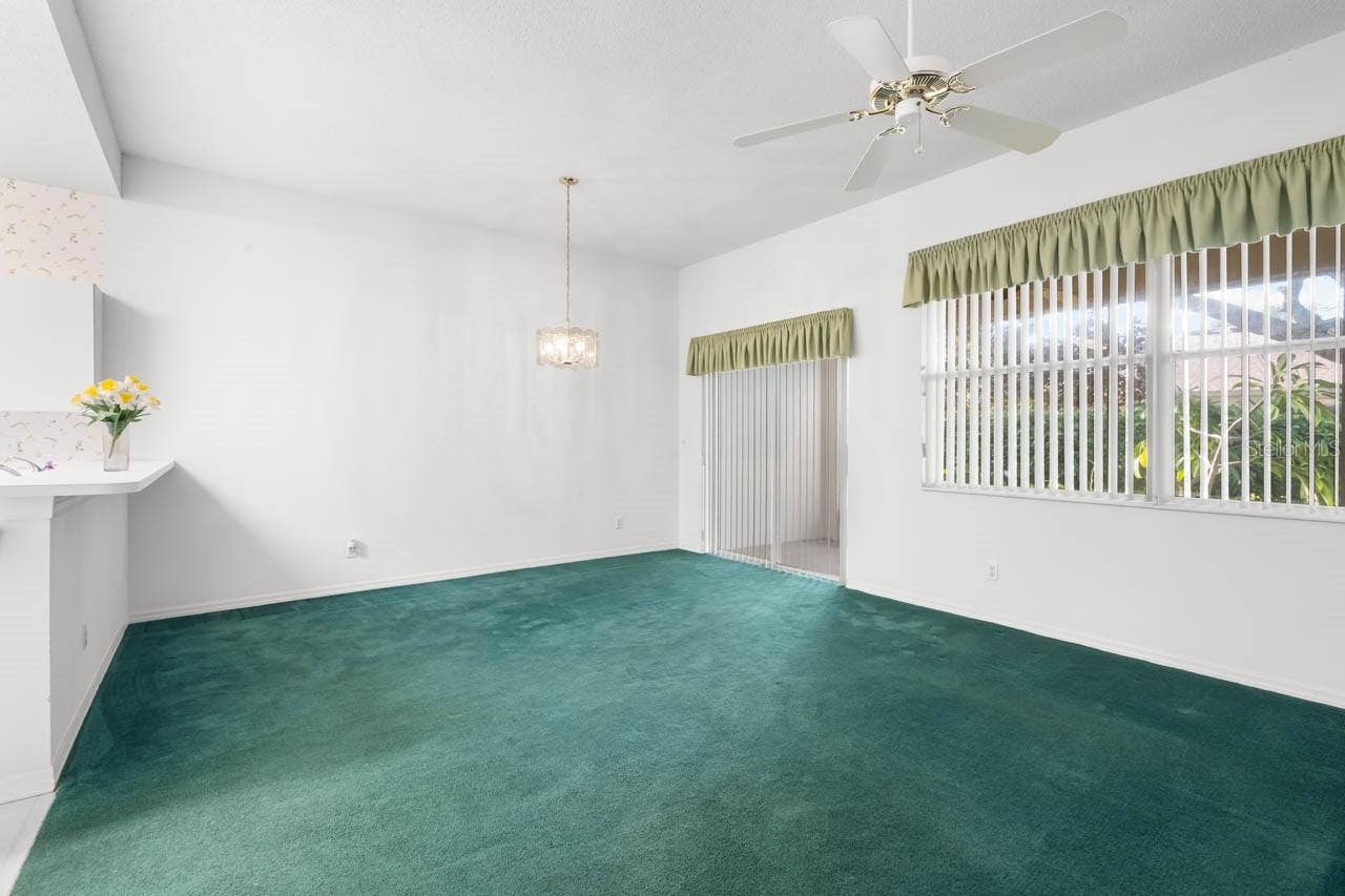 2617 NEWCOMB COURT, Sun City Center, FL 33573 Great room with sliders to screened lanai