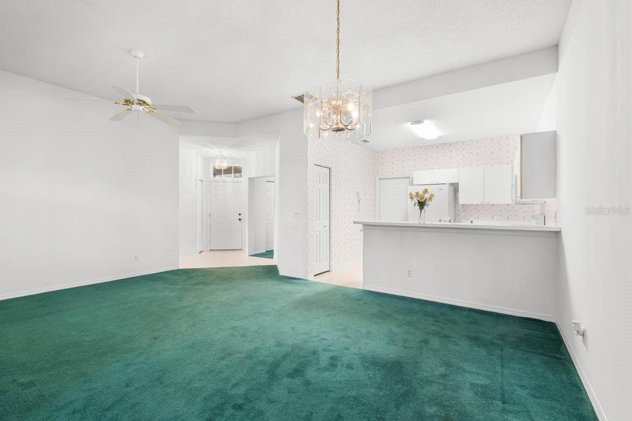 2617 NEWCOMB COURT, Sun City Center, FL 33573 Front door entry way, kitchen, and great room